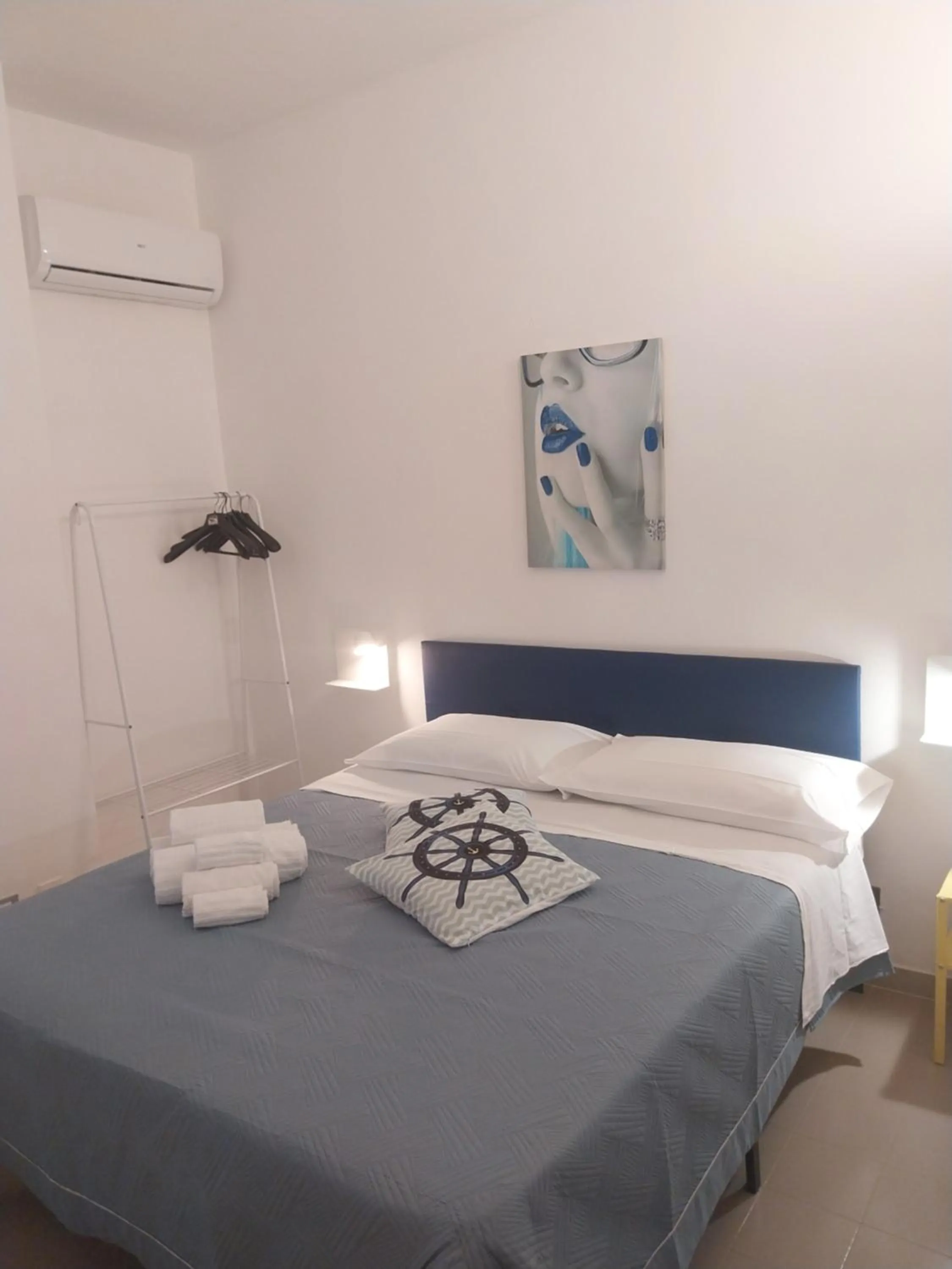 Bed in Le Rocce Holiday Rooms