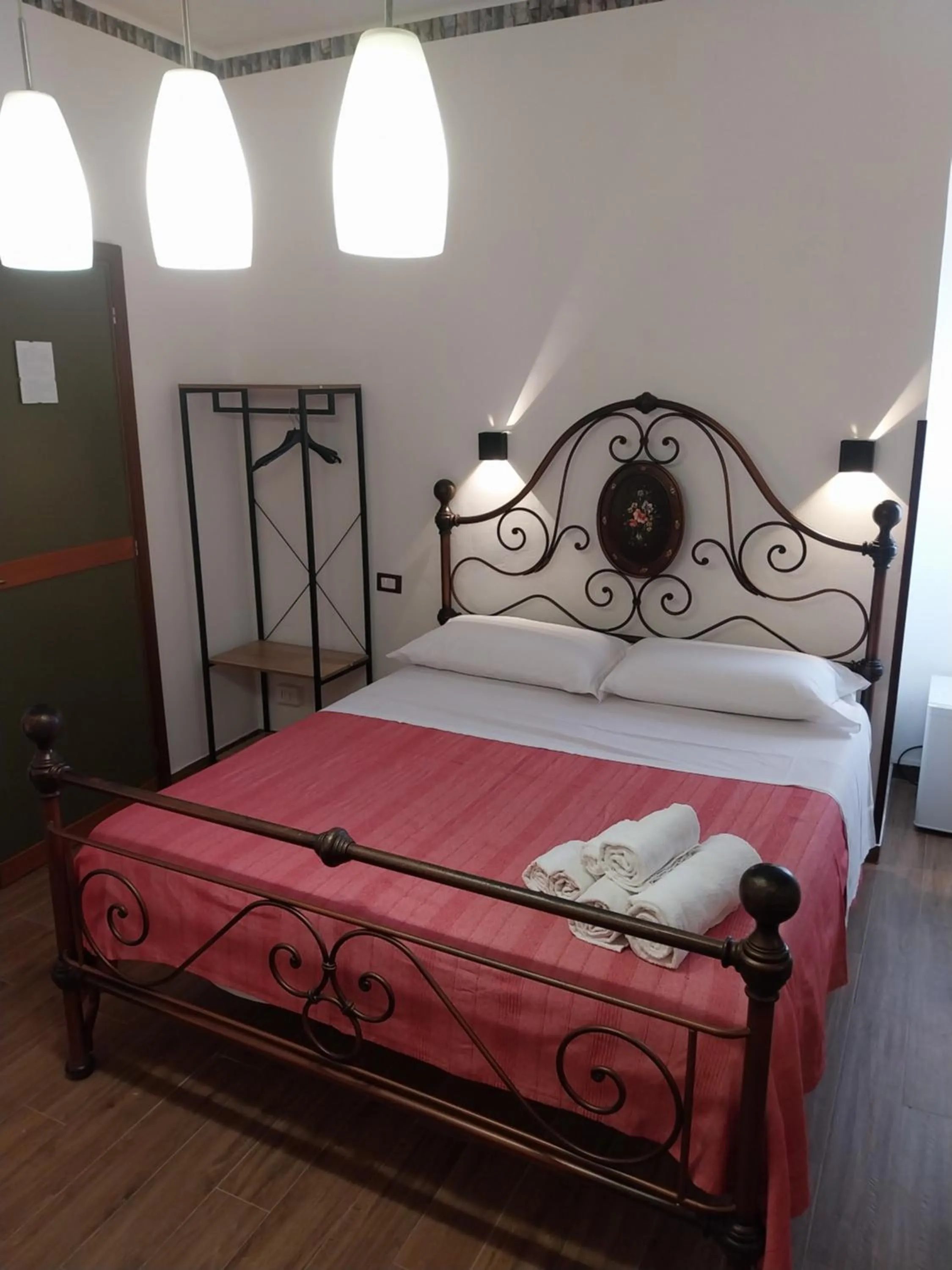 Bed in Le Rocce Holiday Rooms
