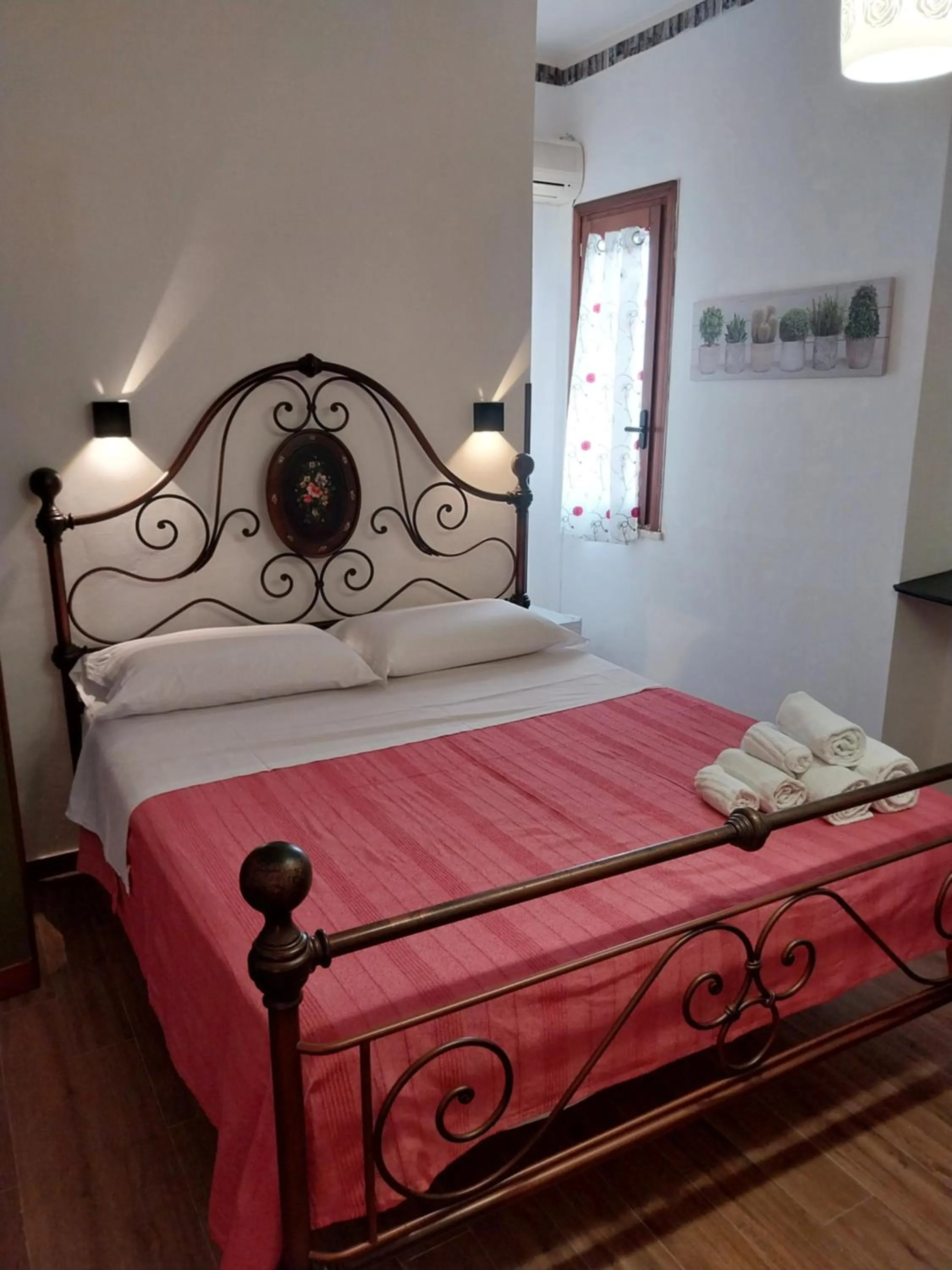 Bed in Le Rocce Holiday Rooms