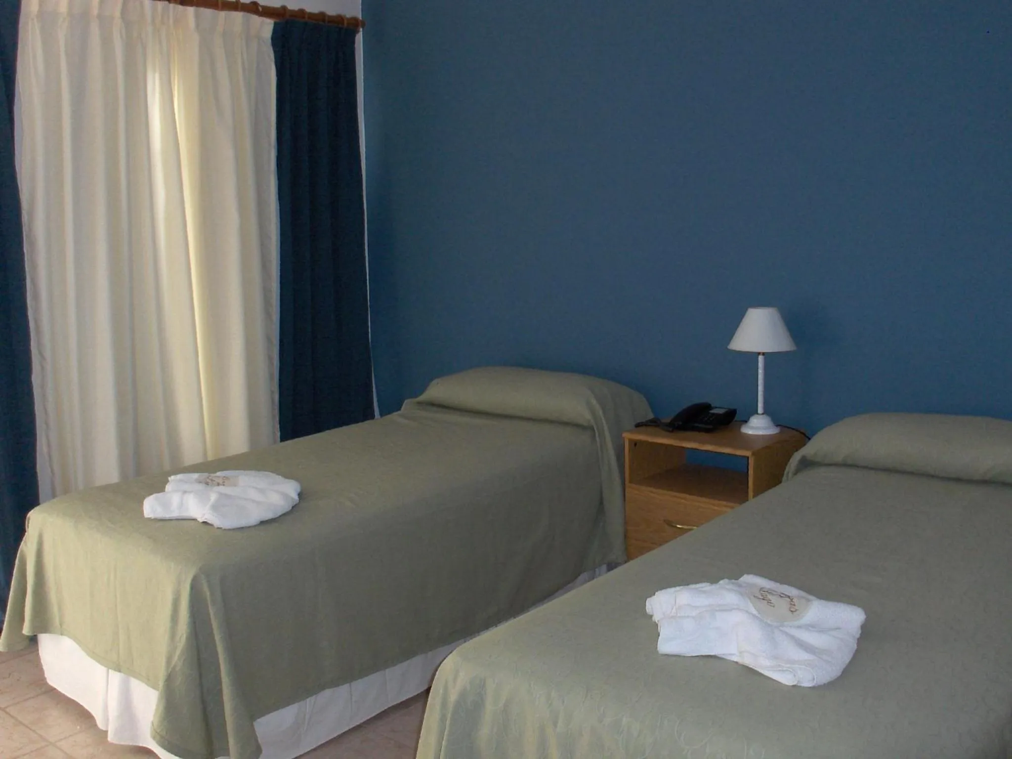 Bed in Brisas del Lago Apart y Hotel