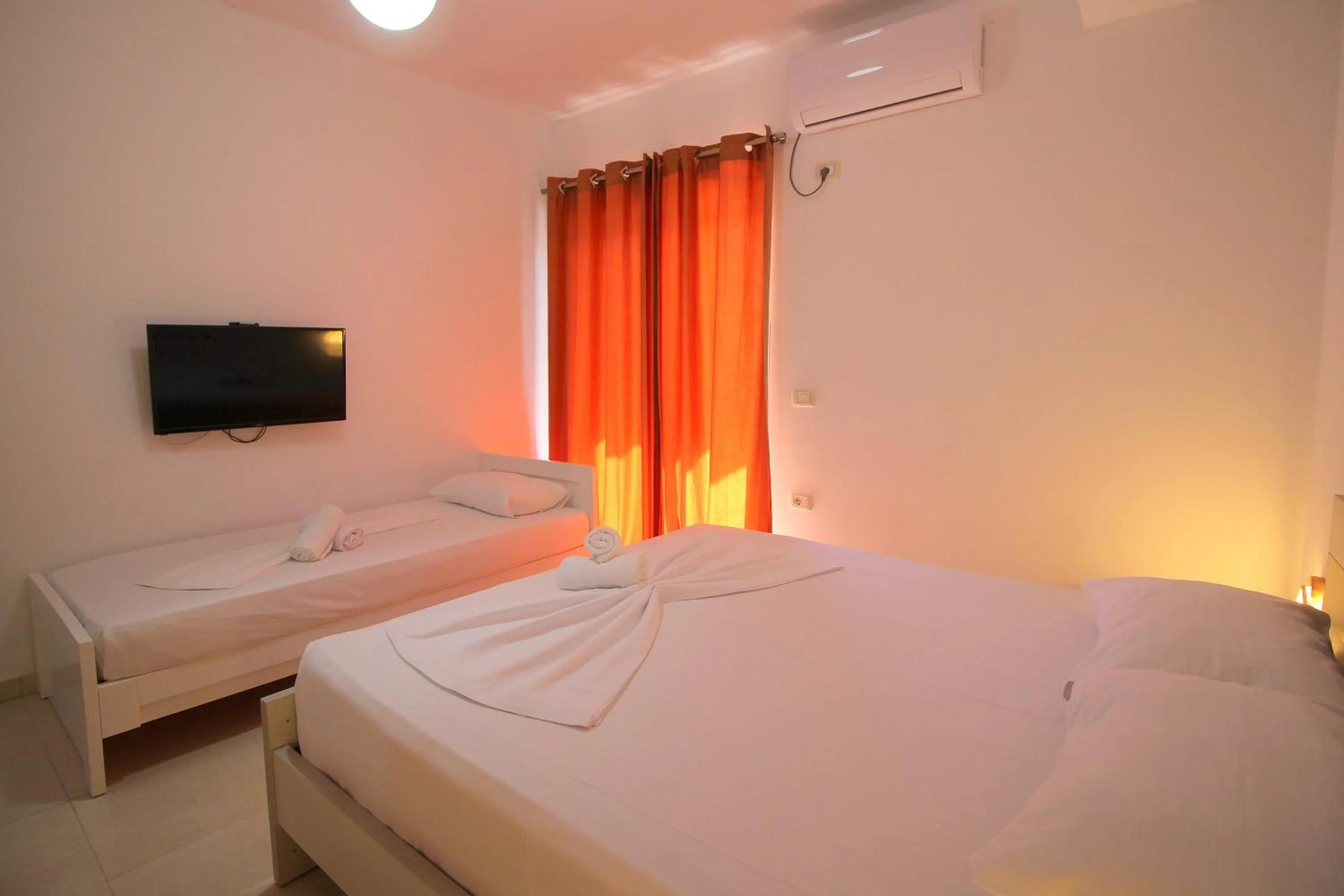 Bed in Hotel Argjiro