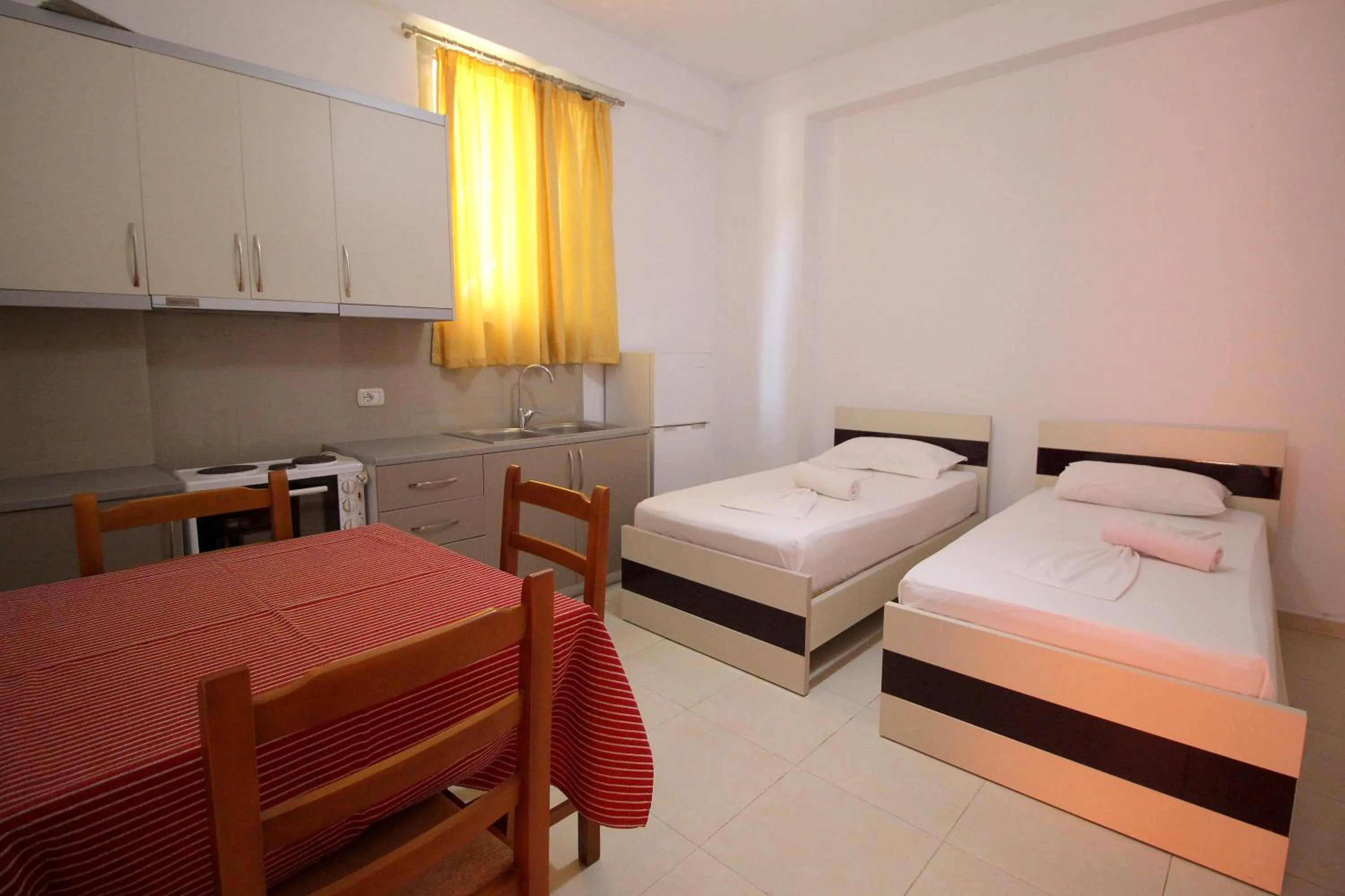 Kitchen or kitchenette, Bed in Hotel Argjiro