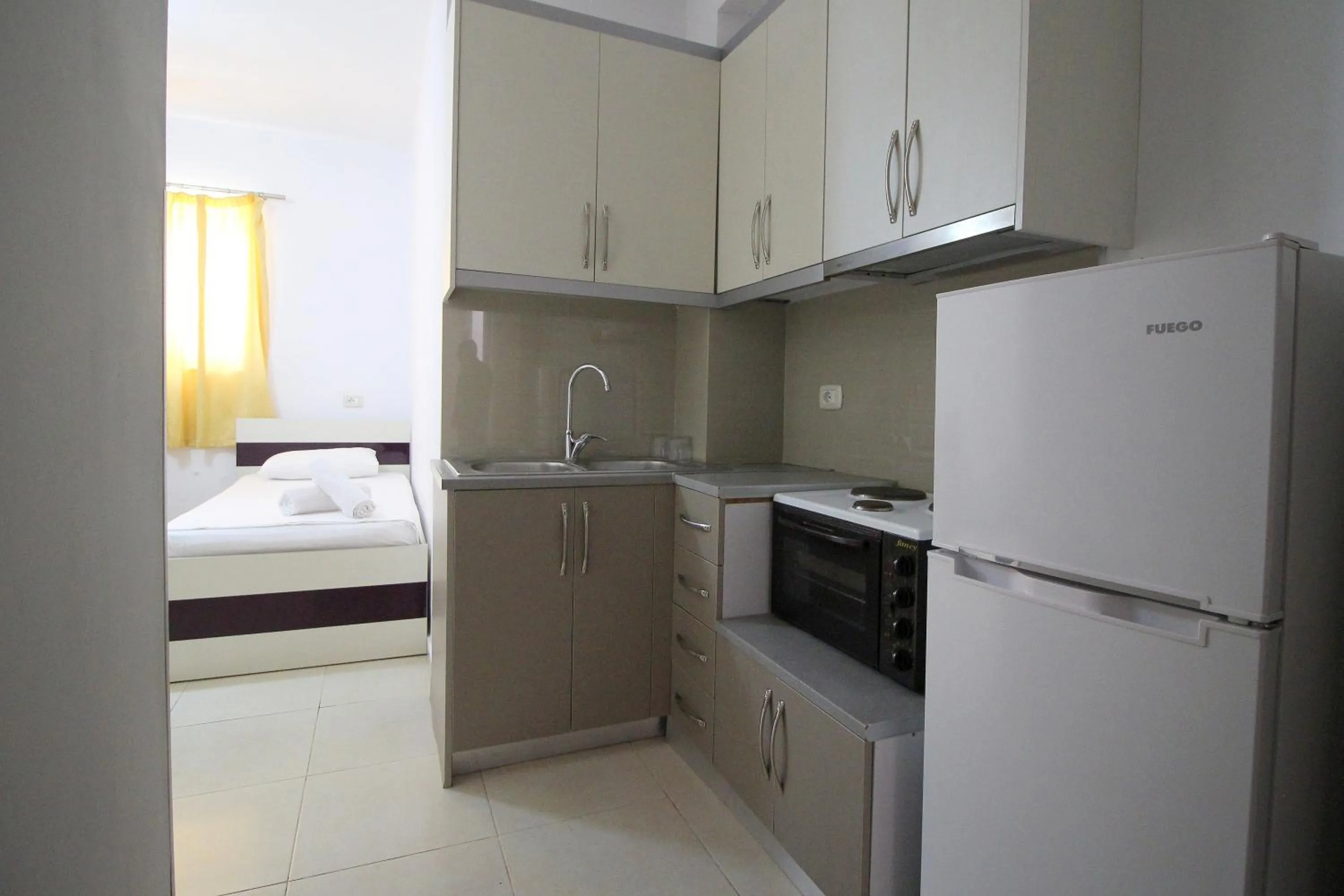 Kitchen or kitchenette, Bed in Hotel Argjiro