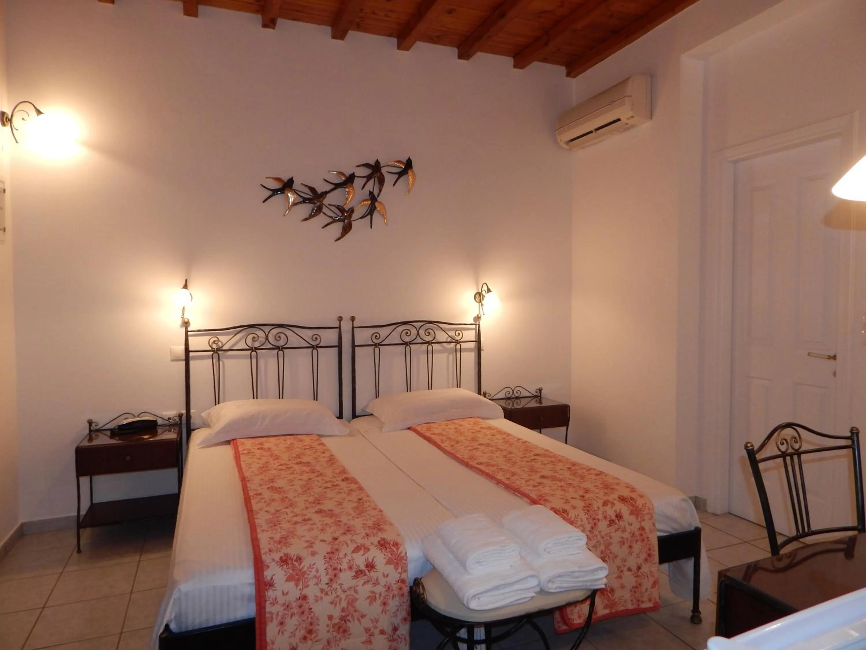 Bed in Tinos Suites & Apartments