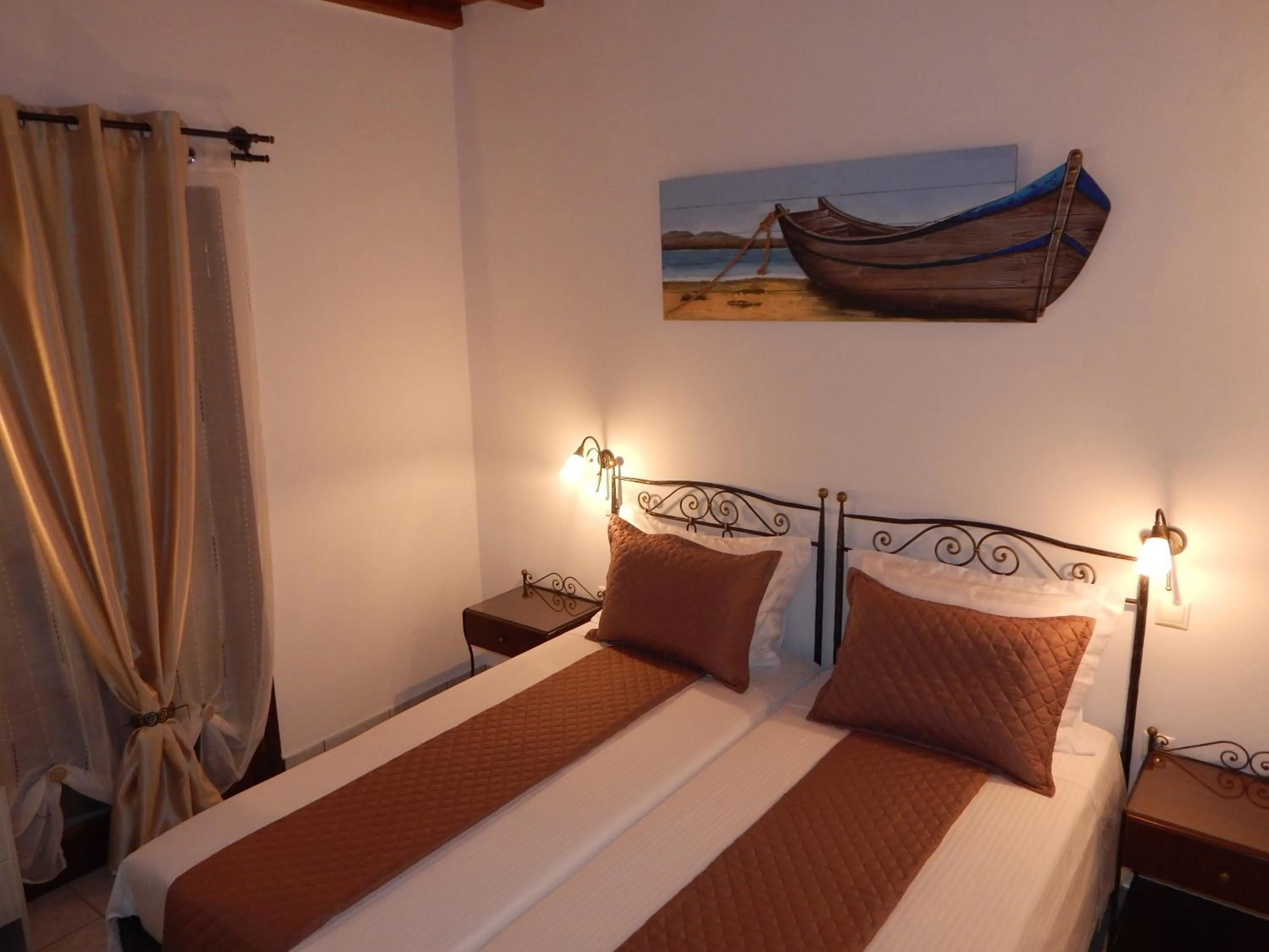 Bed in Tinos Suites & Apartments