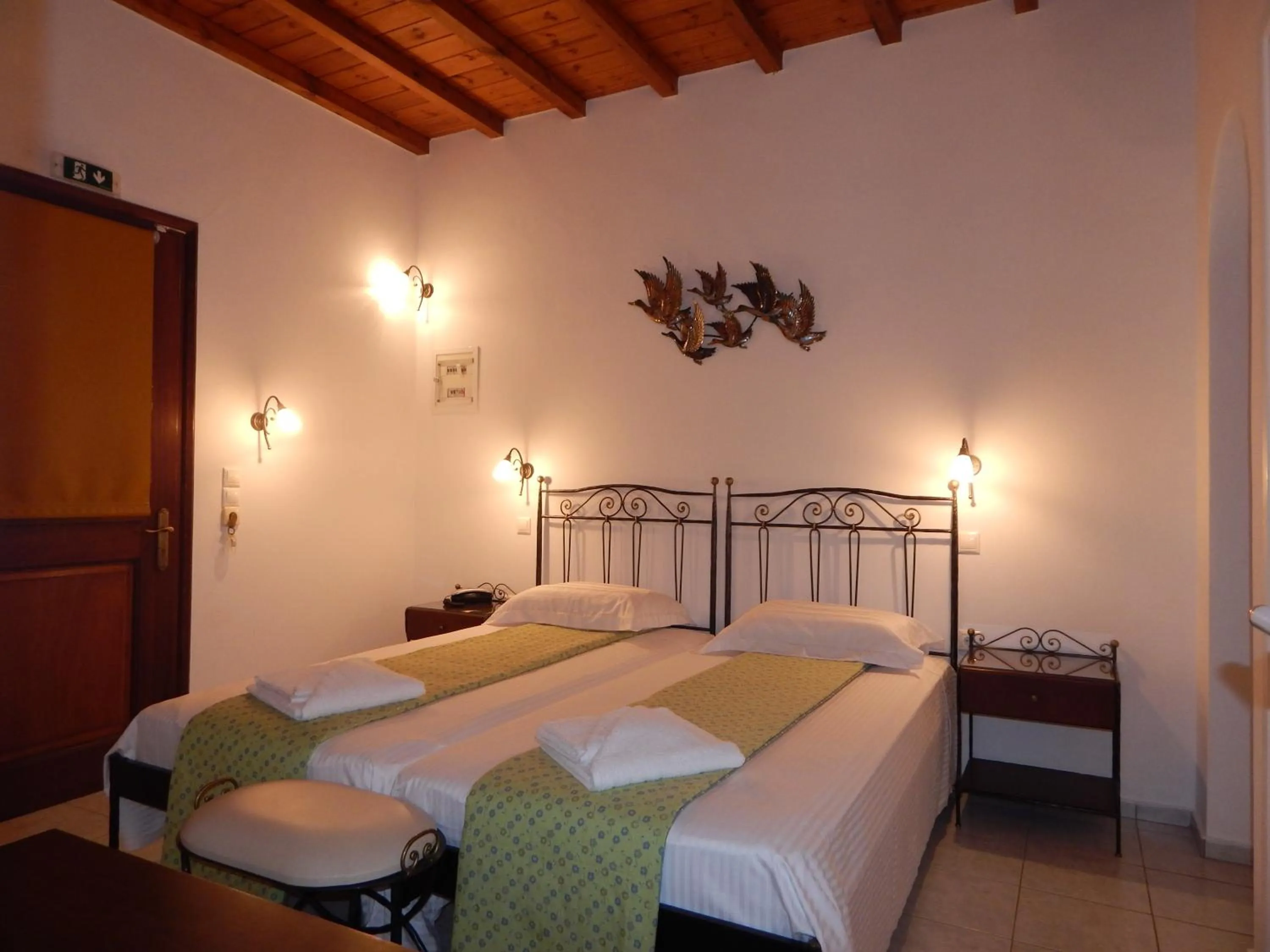 Bed in Tinos Suites & Apartments