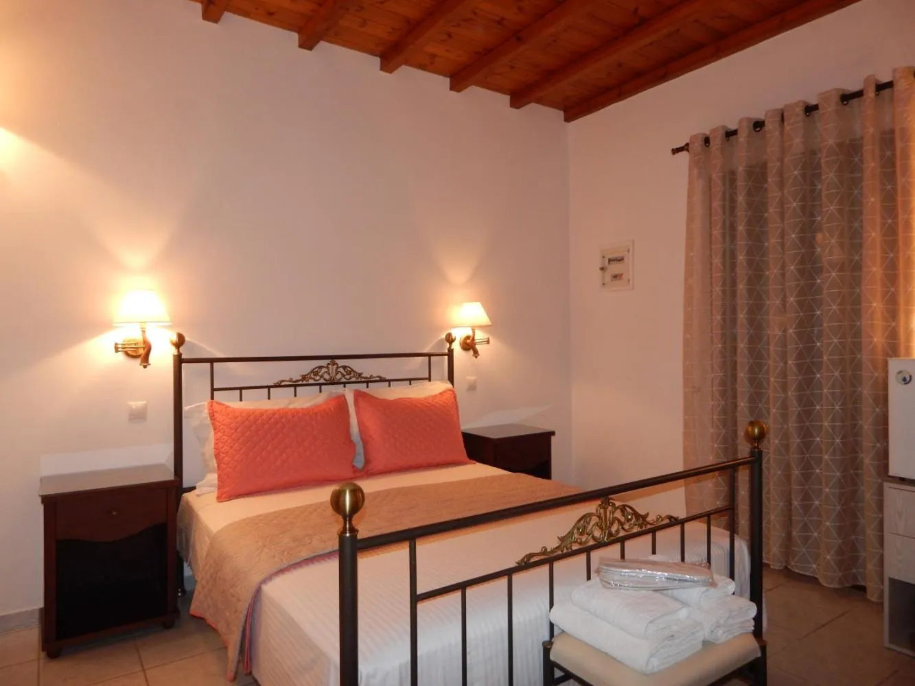 Bed in Tinos Suites & Apartments