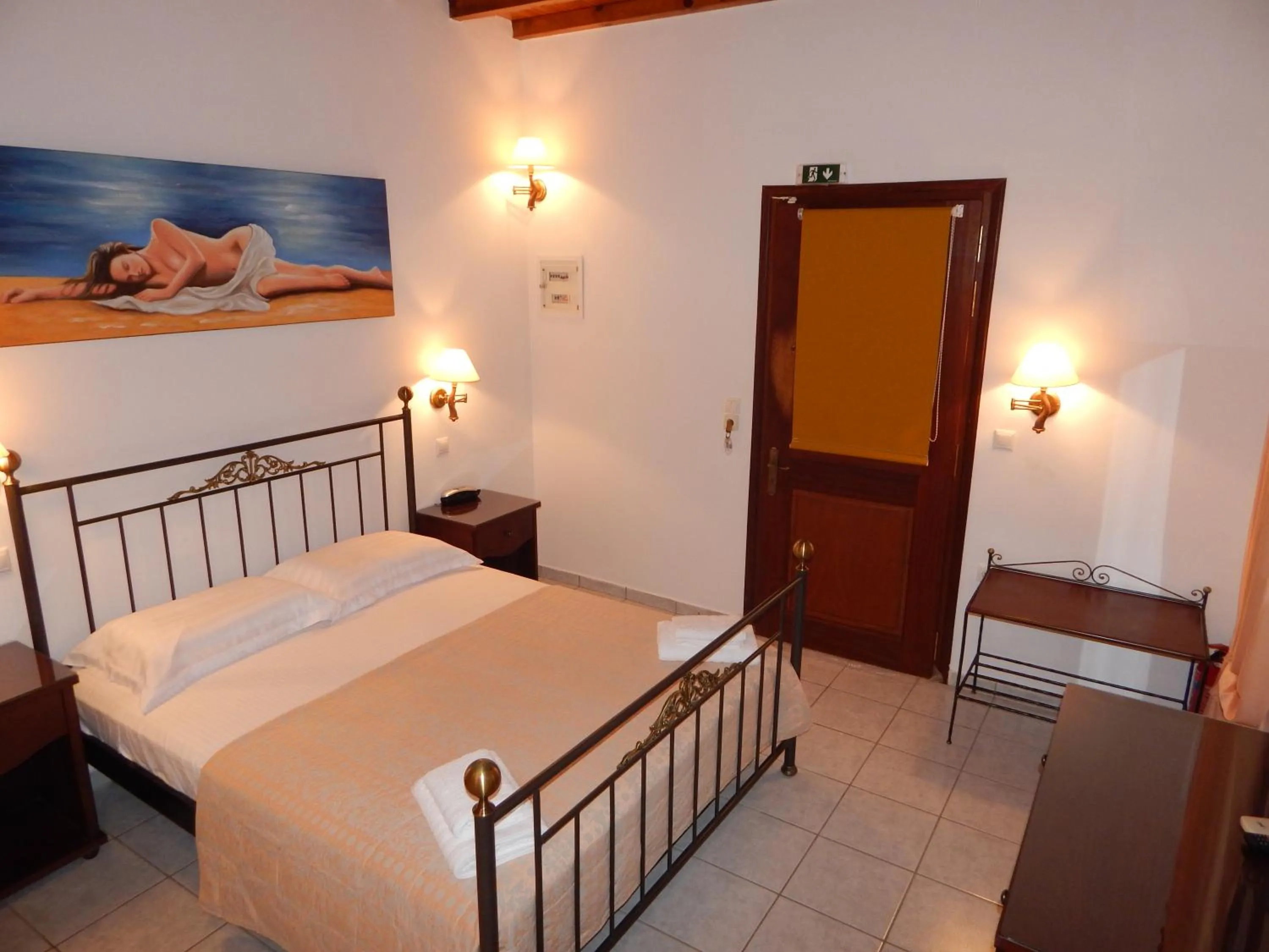 Bed in Tinos Suites & Apartments