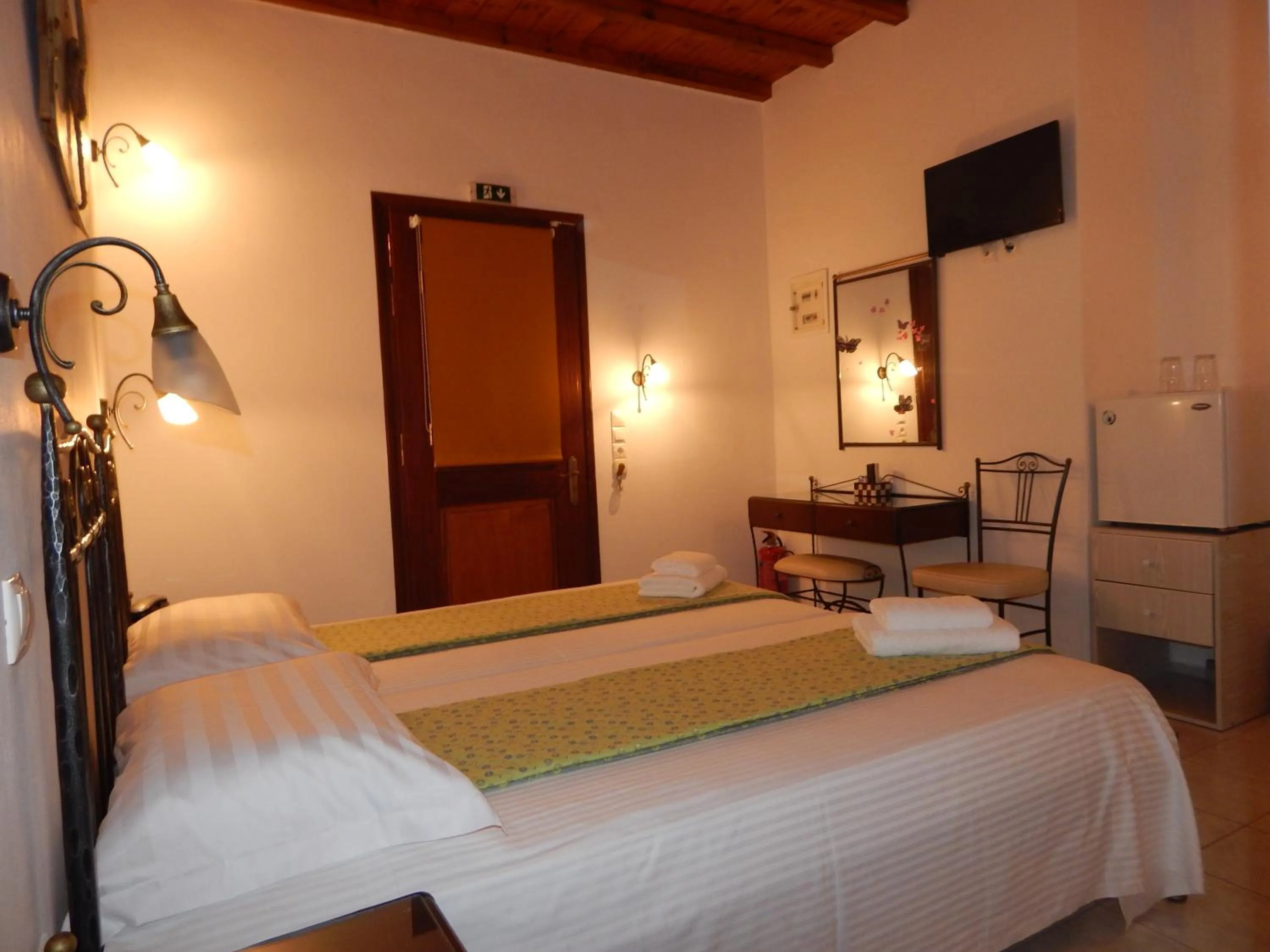 Bed in Tinos Suites & Apartments