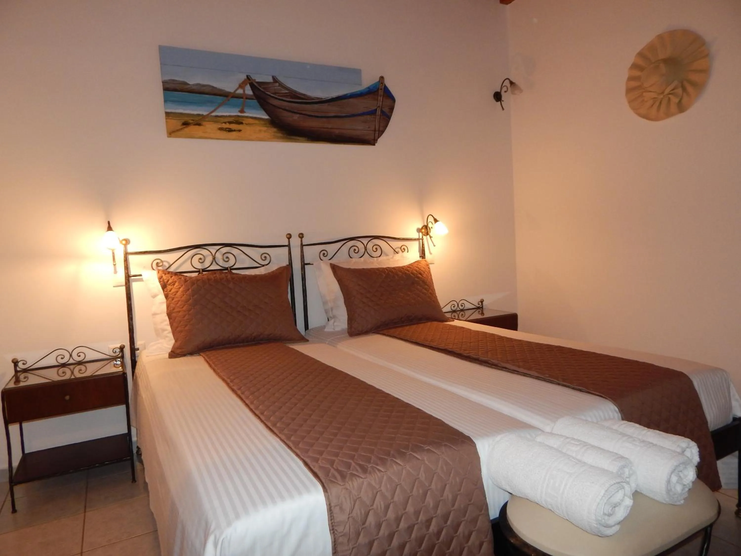 Bed in Tinos Suites & Apartments