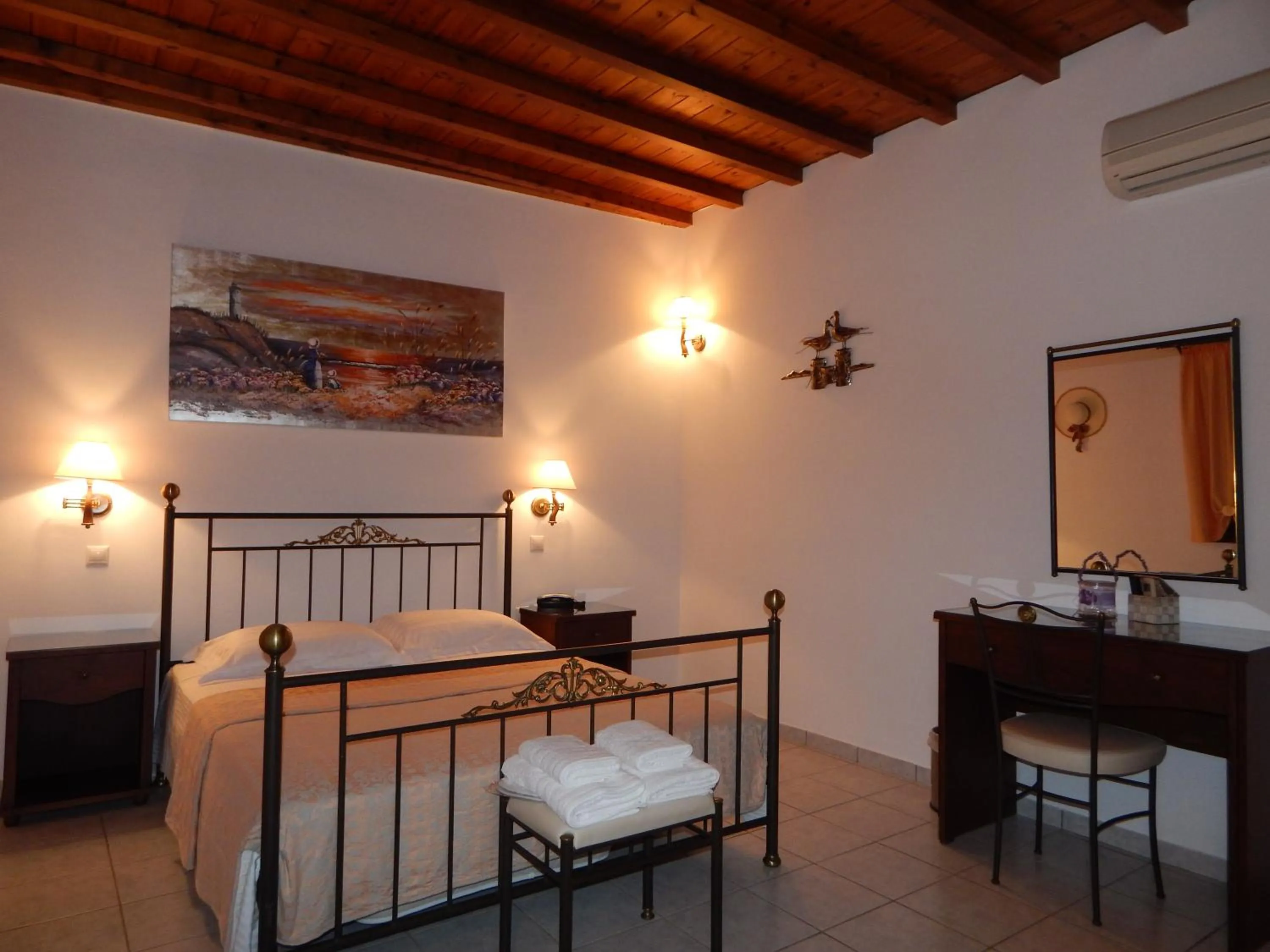 Bed in Tinos Suites & Apartments