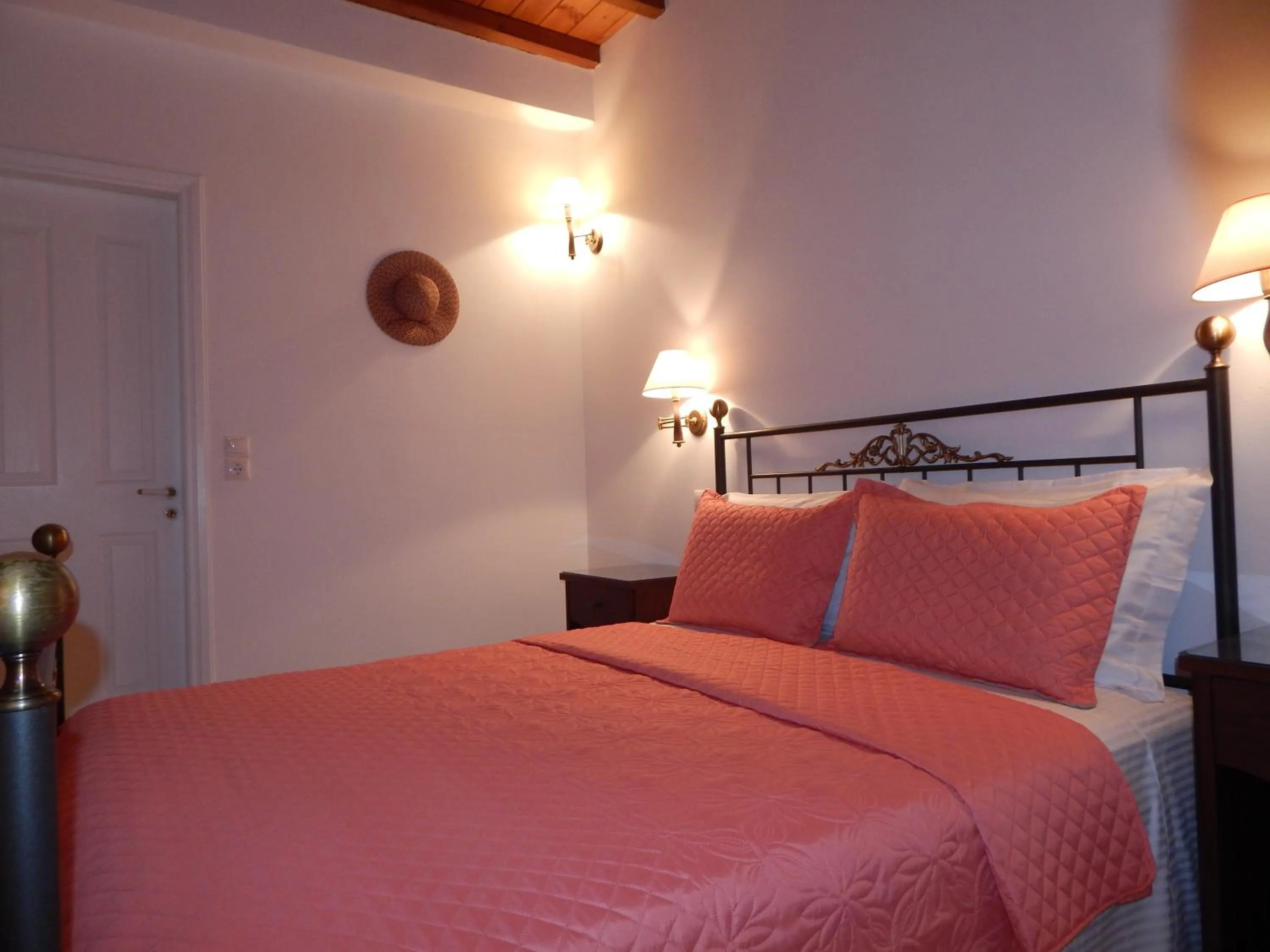 Bed in Tinos Suites & Apartments