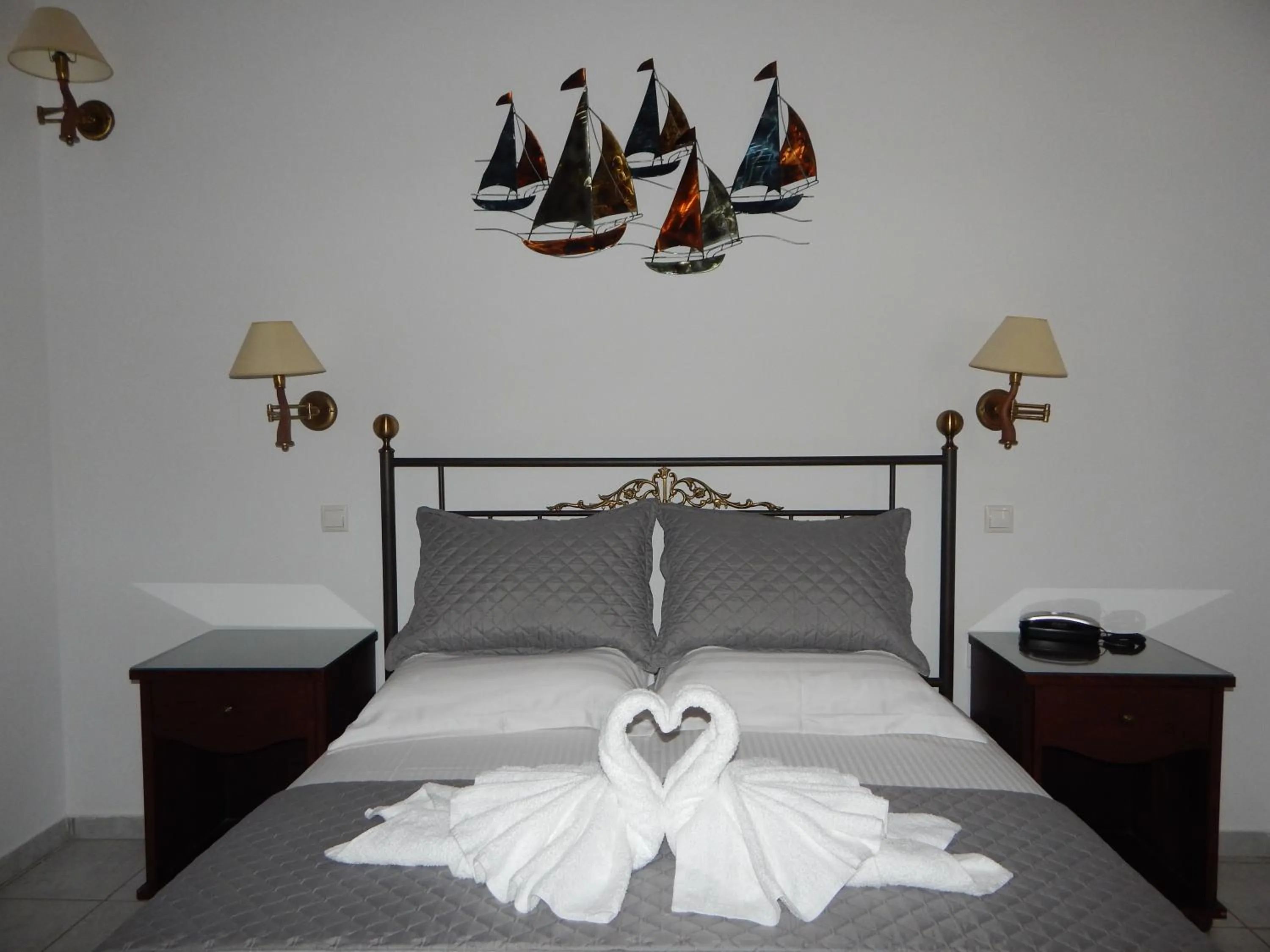 Bed in Tinos Suites & Apartments