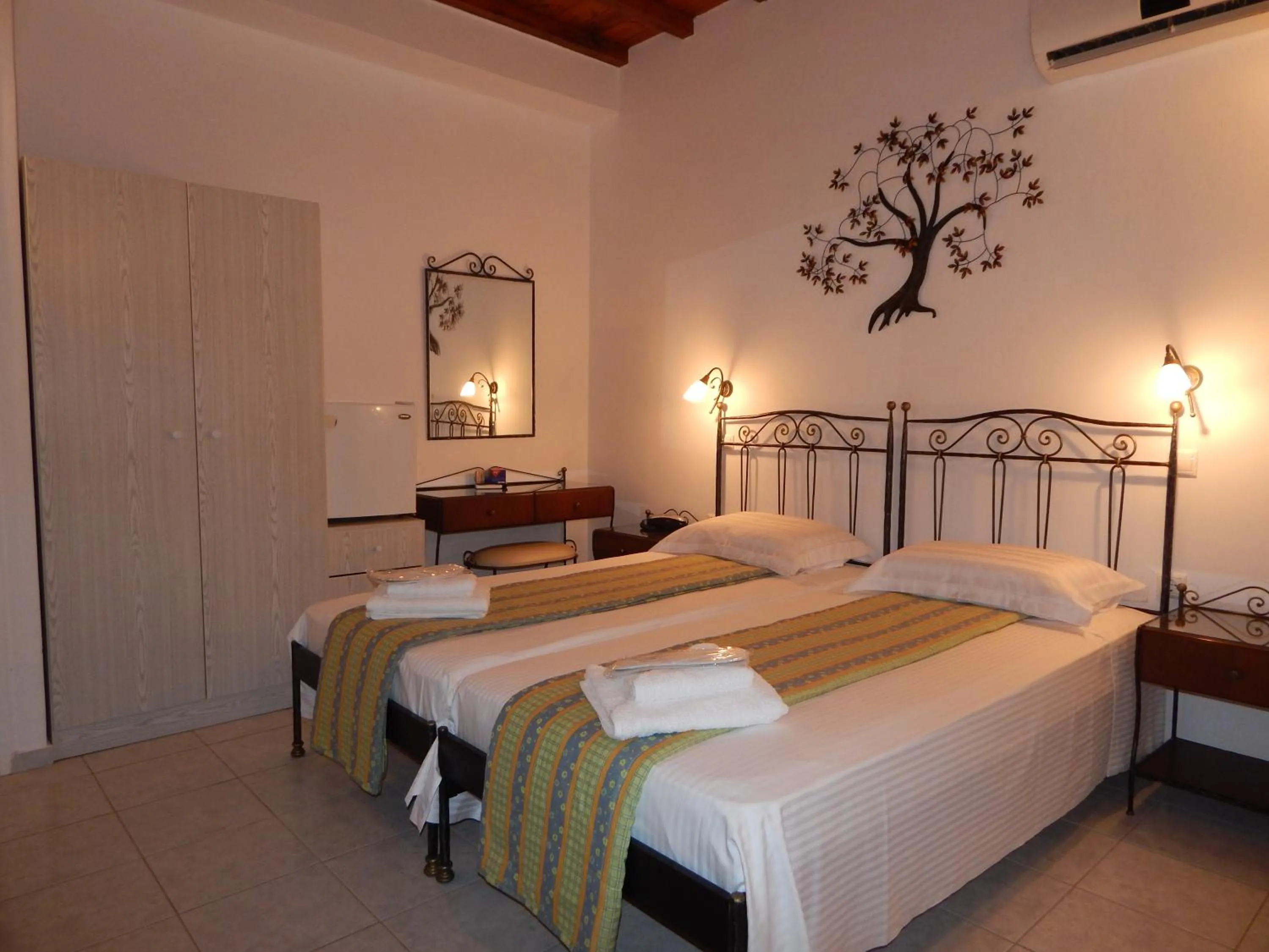 Bed in Tinos Suites & Apartments