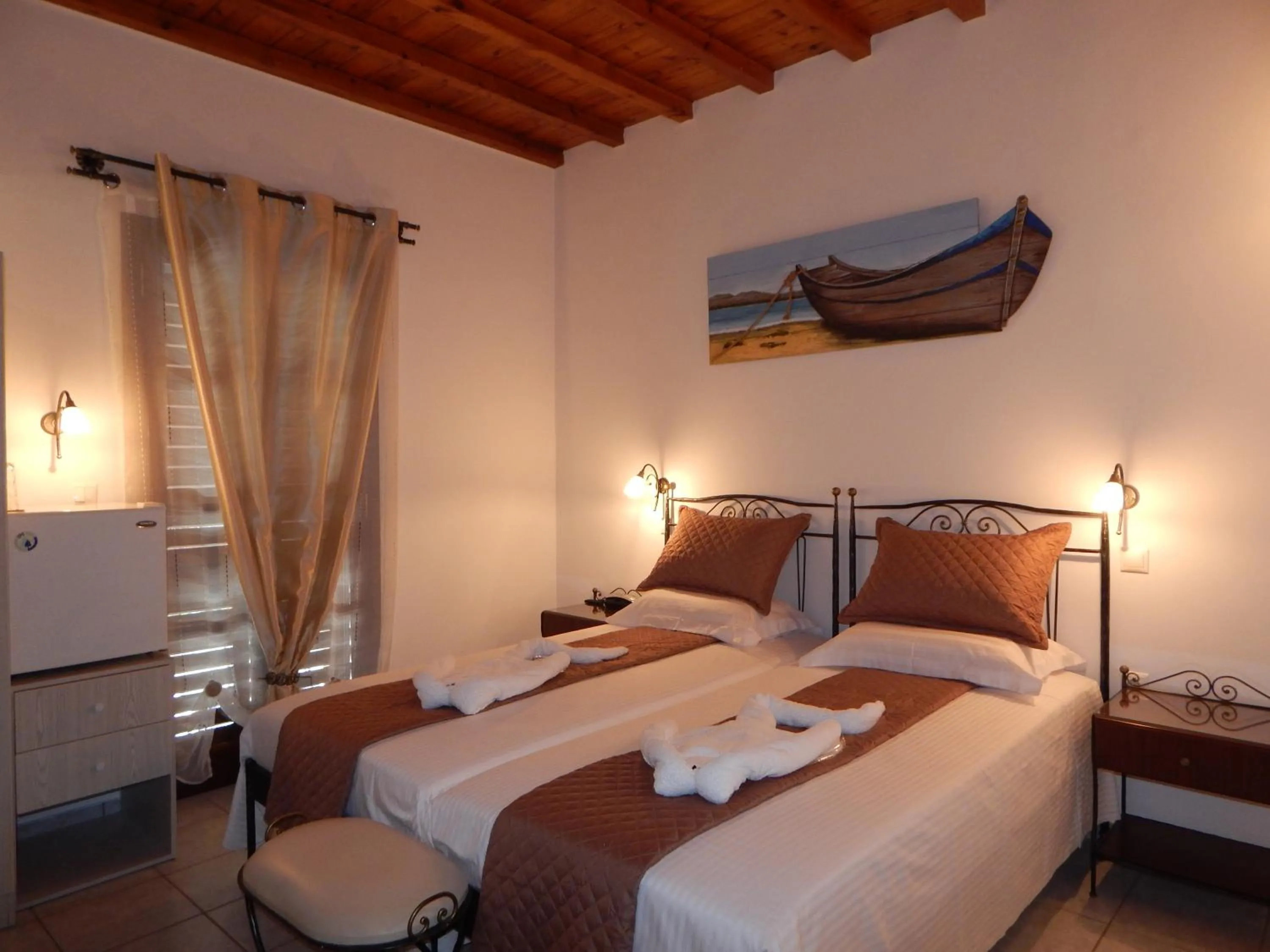 Bed in Tinos Suites & Apartments