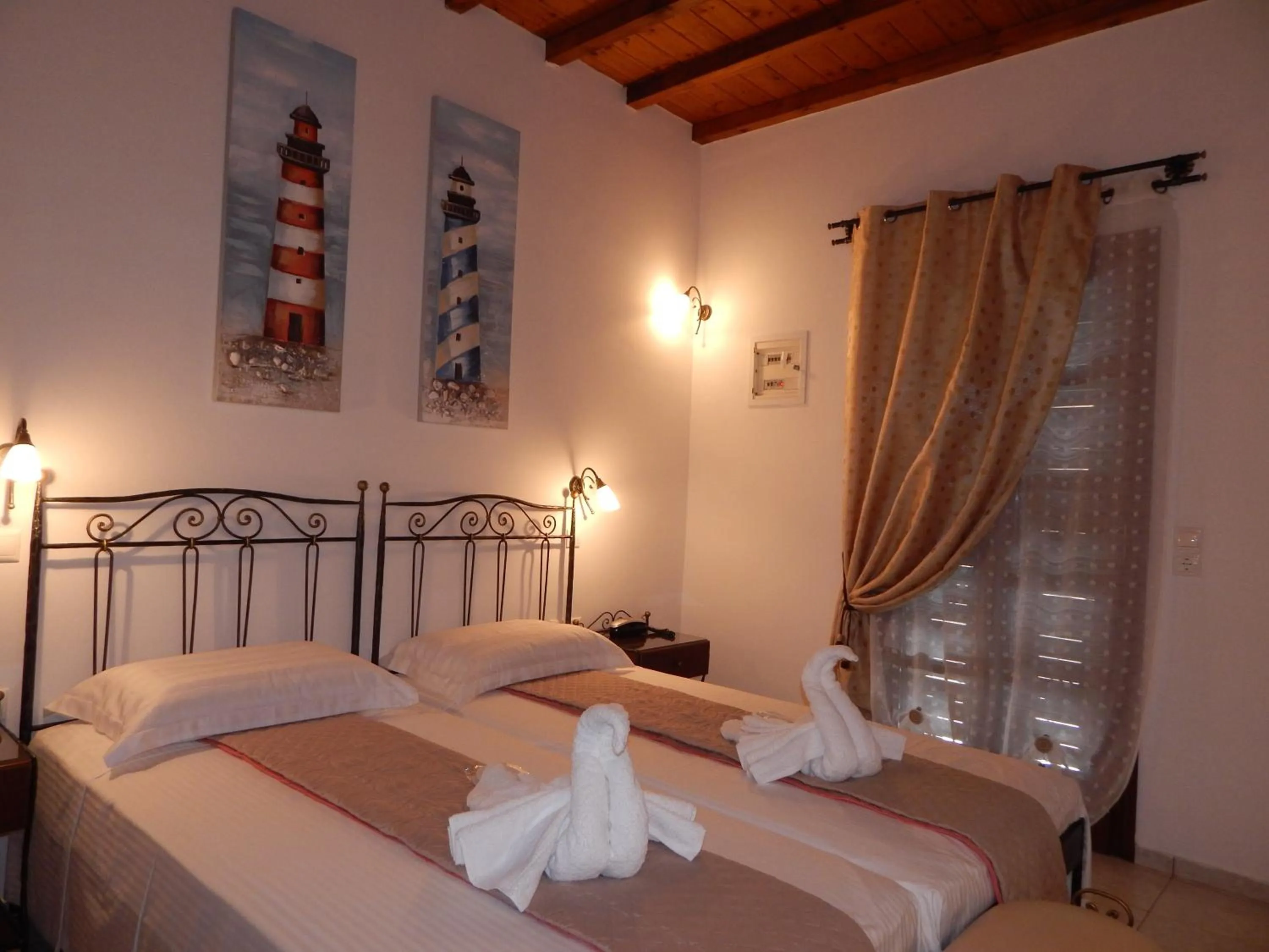 Bed in Tinos Suites & Apartments