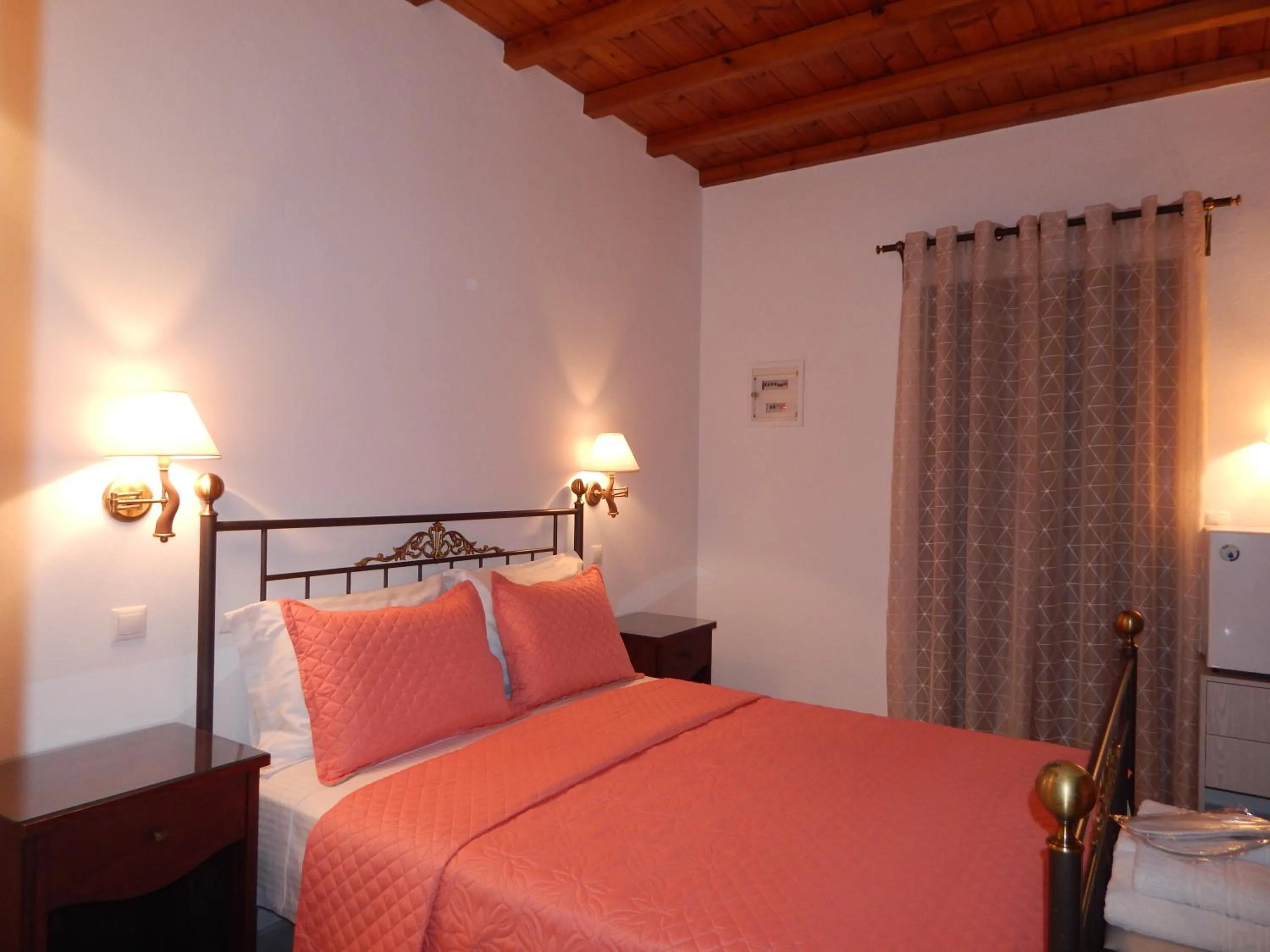 Bed in Tinos Suites & Apartments