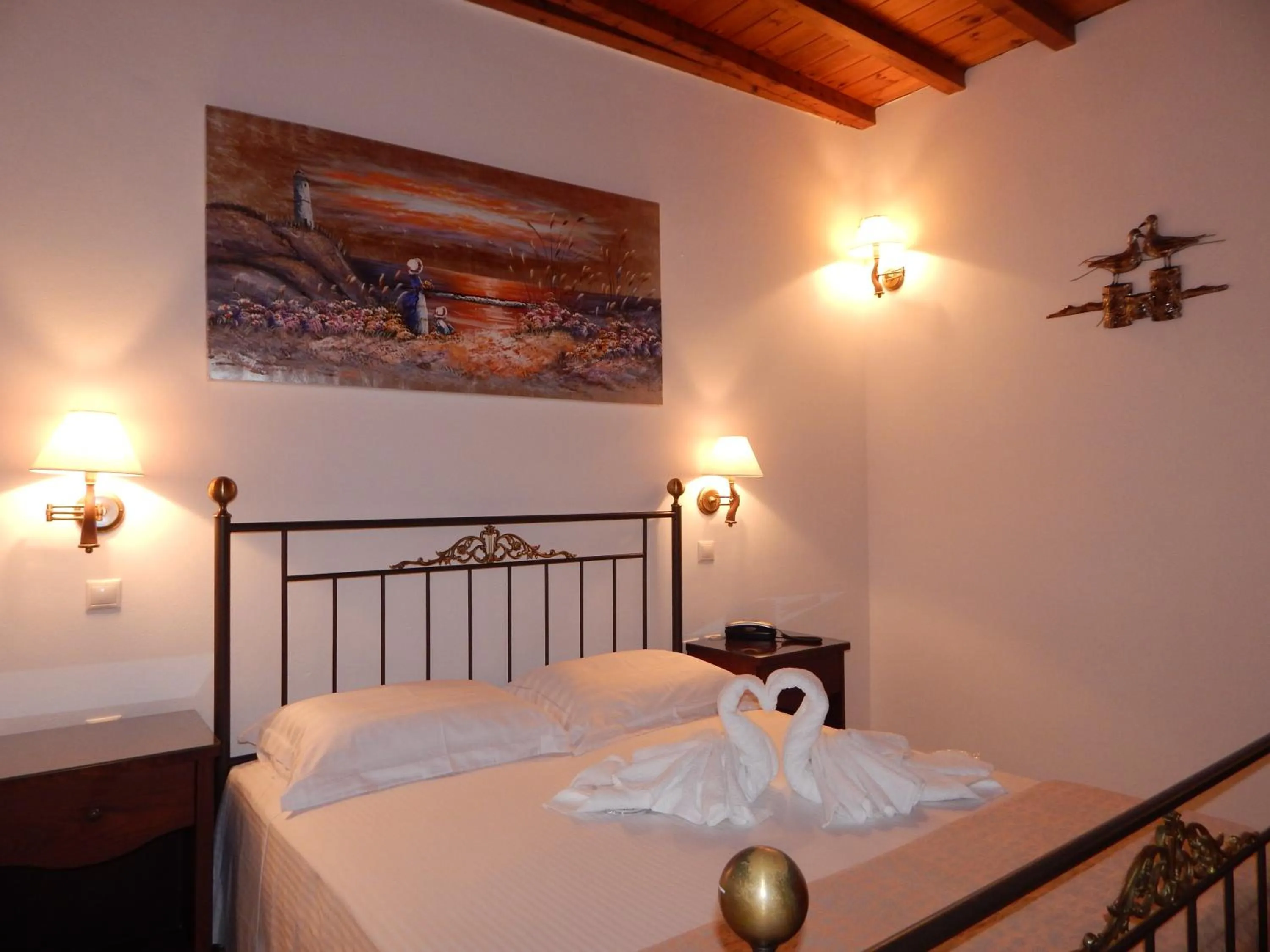 Bed in Tinos Suites & Apartments