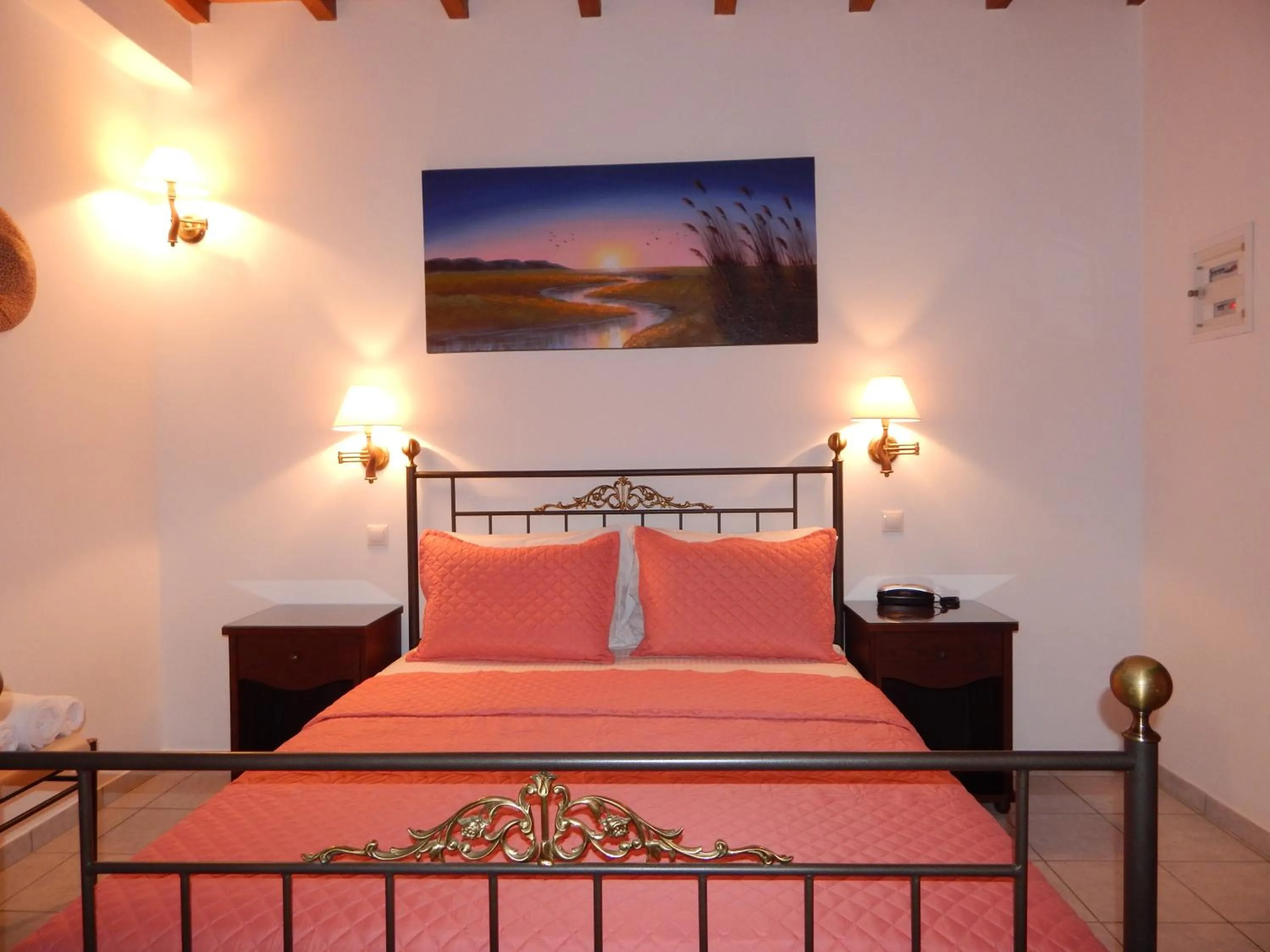 Bed in Tinos Suites & Apartments