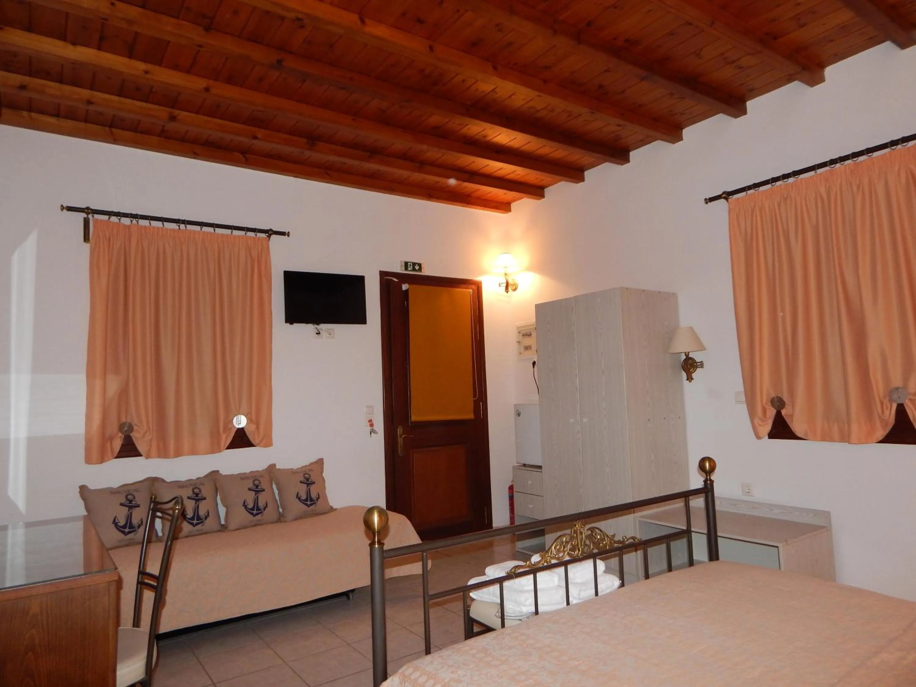 Bed in Tinos Suites & Apartments