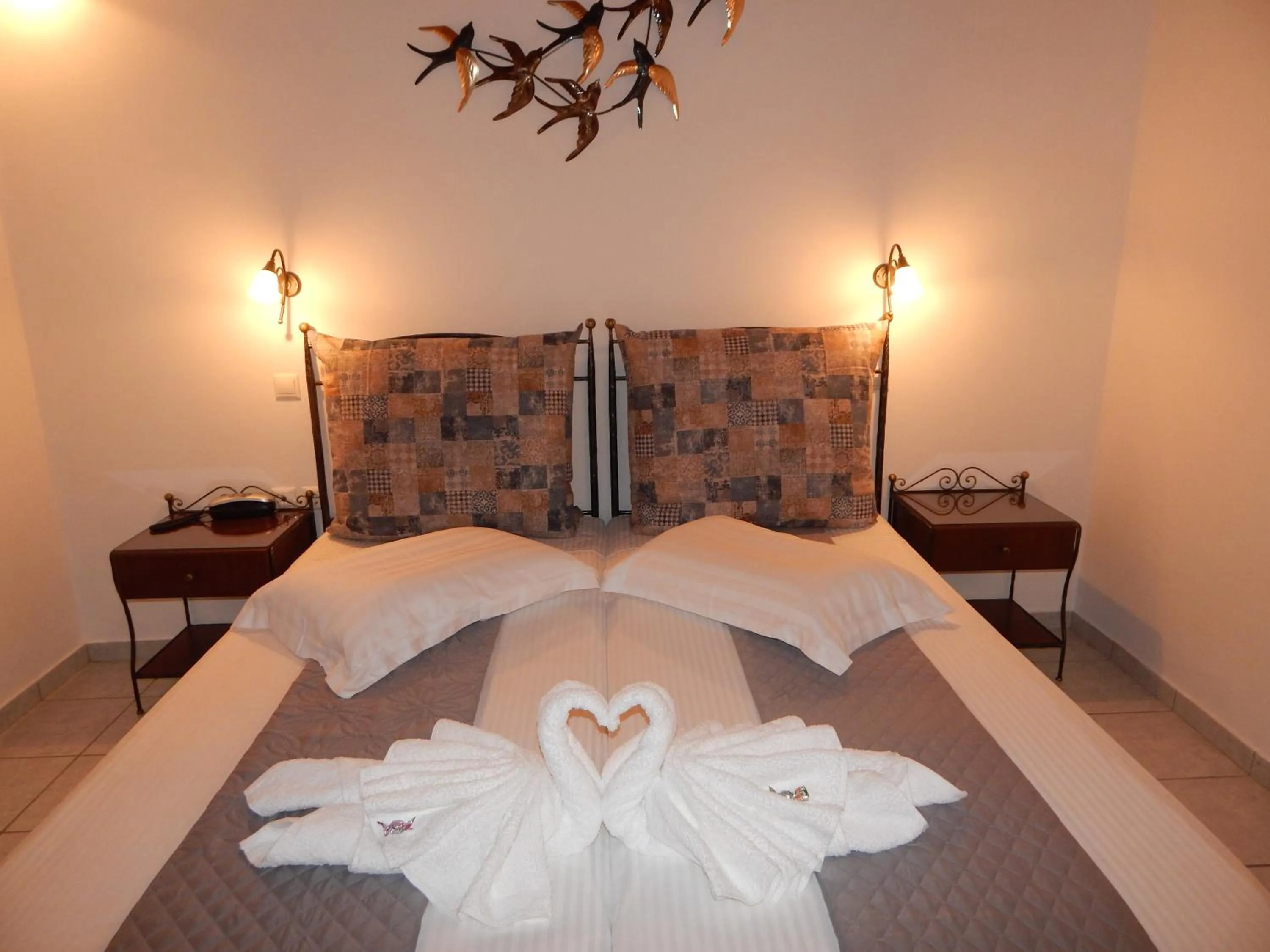 Bed in Tinos Suites & Apartments