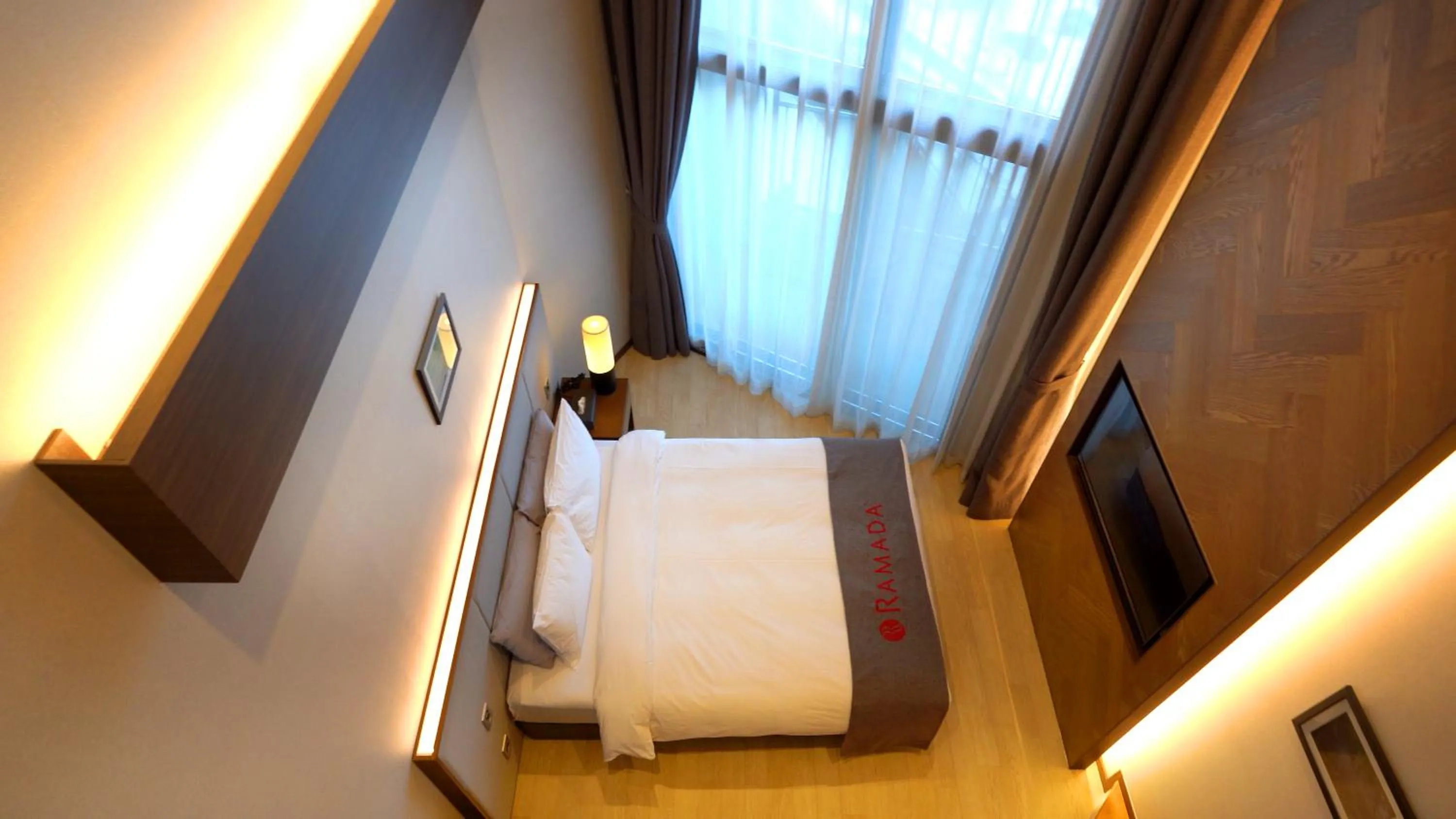 Bed in Ramada Hotel & Suite by Wyndham Gangwon Pyeongchang