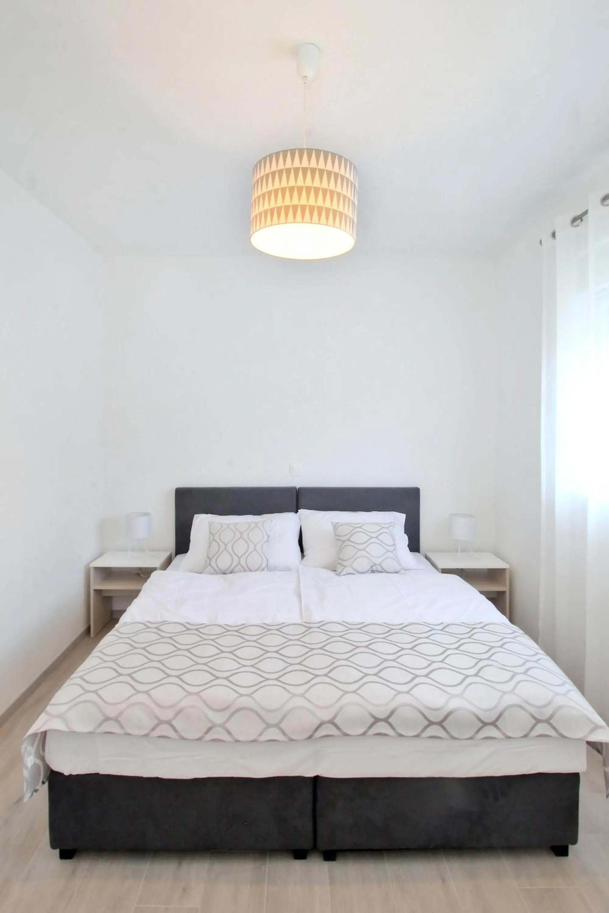 Bed in Bacan Family Apartments