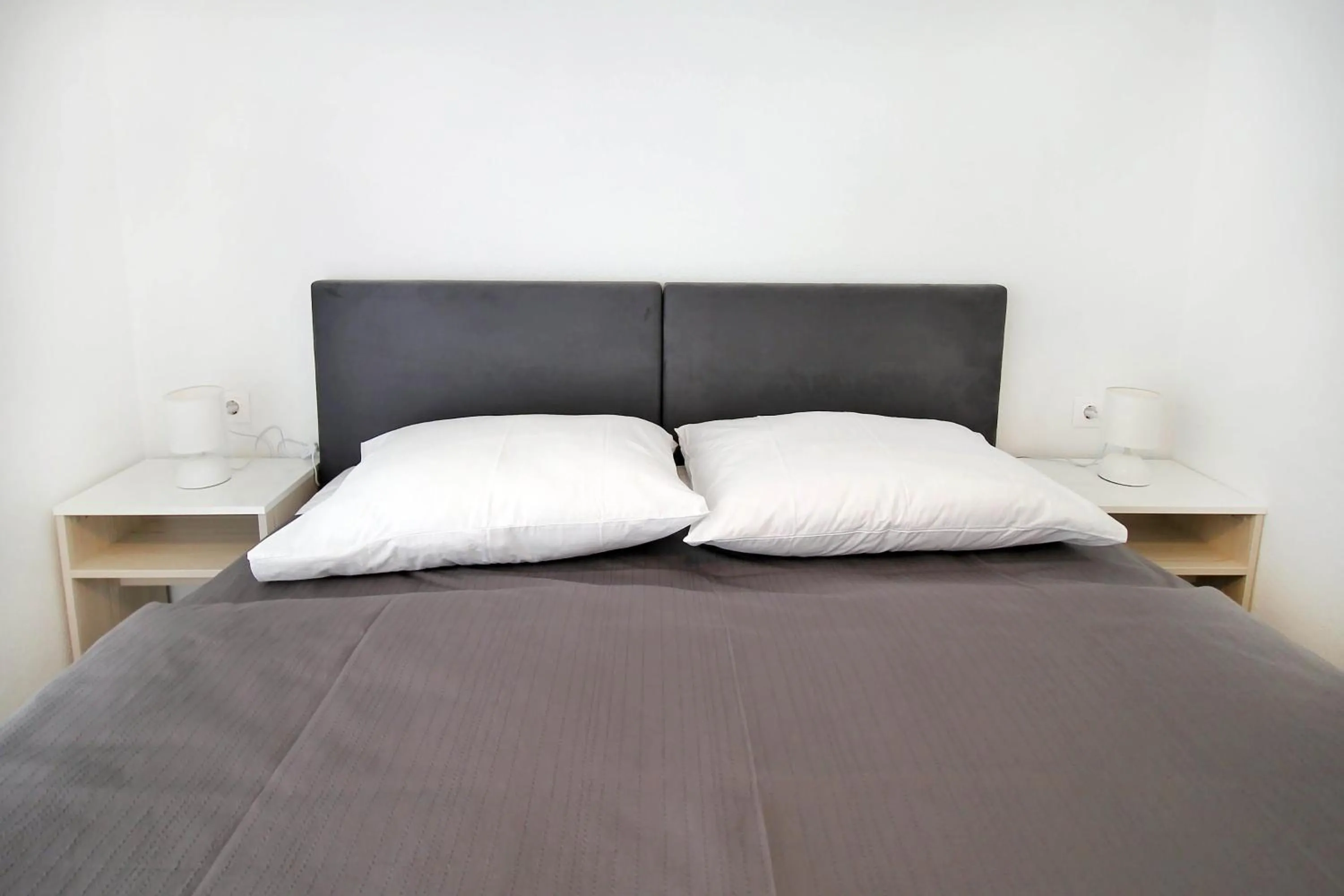 Bed in Bacan Family Apartments