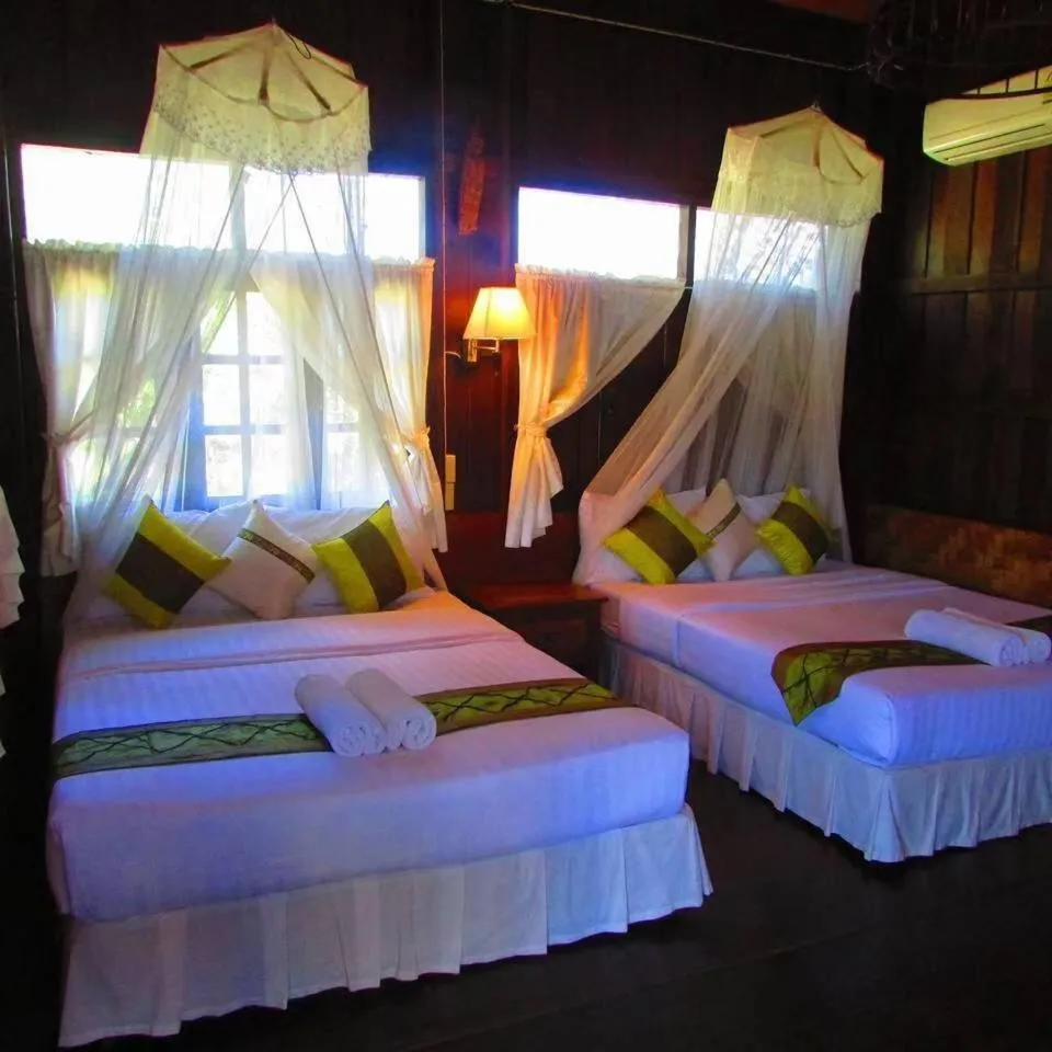 Bed in Vimarnkiri Resort