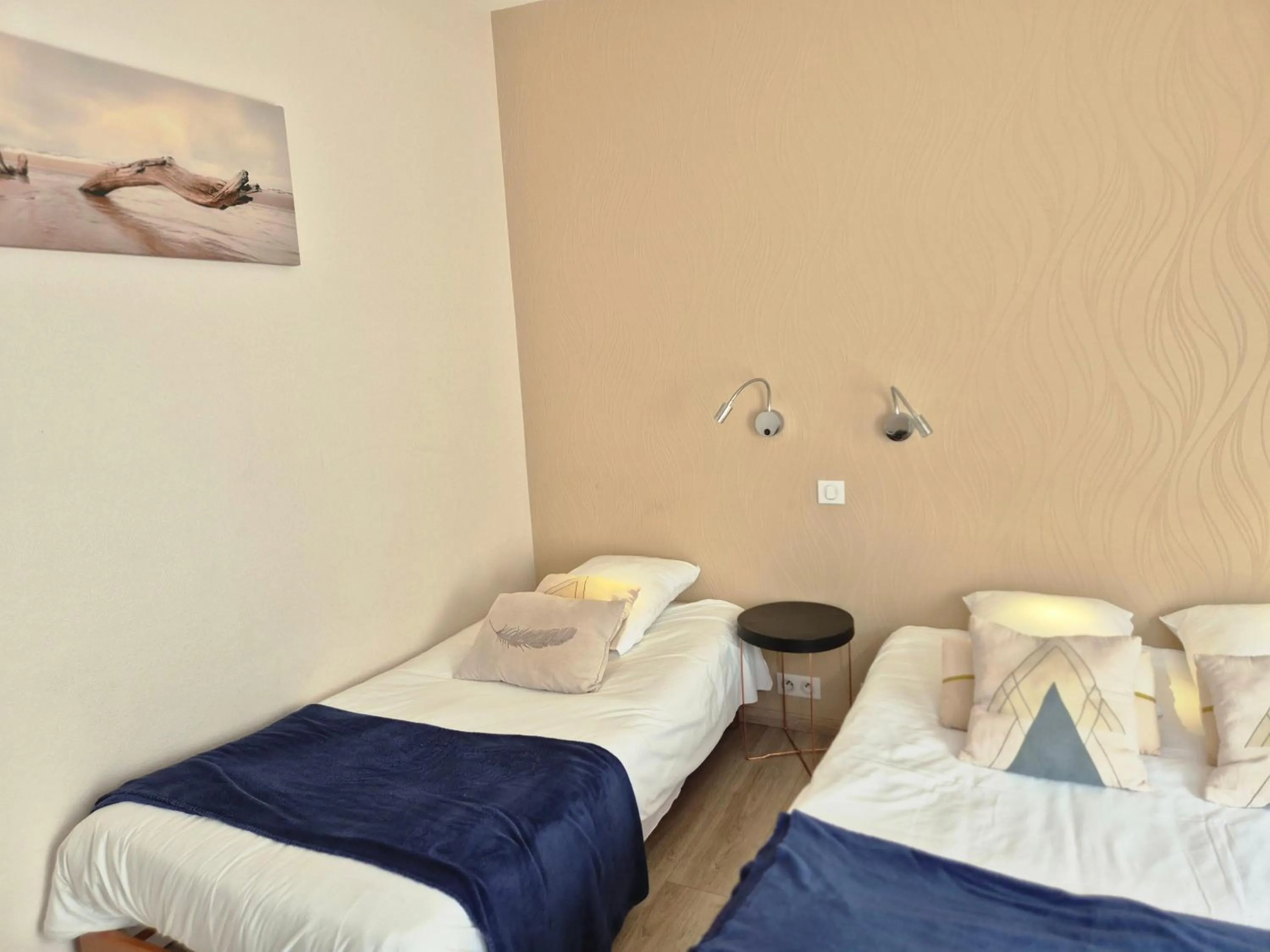 Bed in Logis Hôtel Restaurant L'Oustal