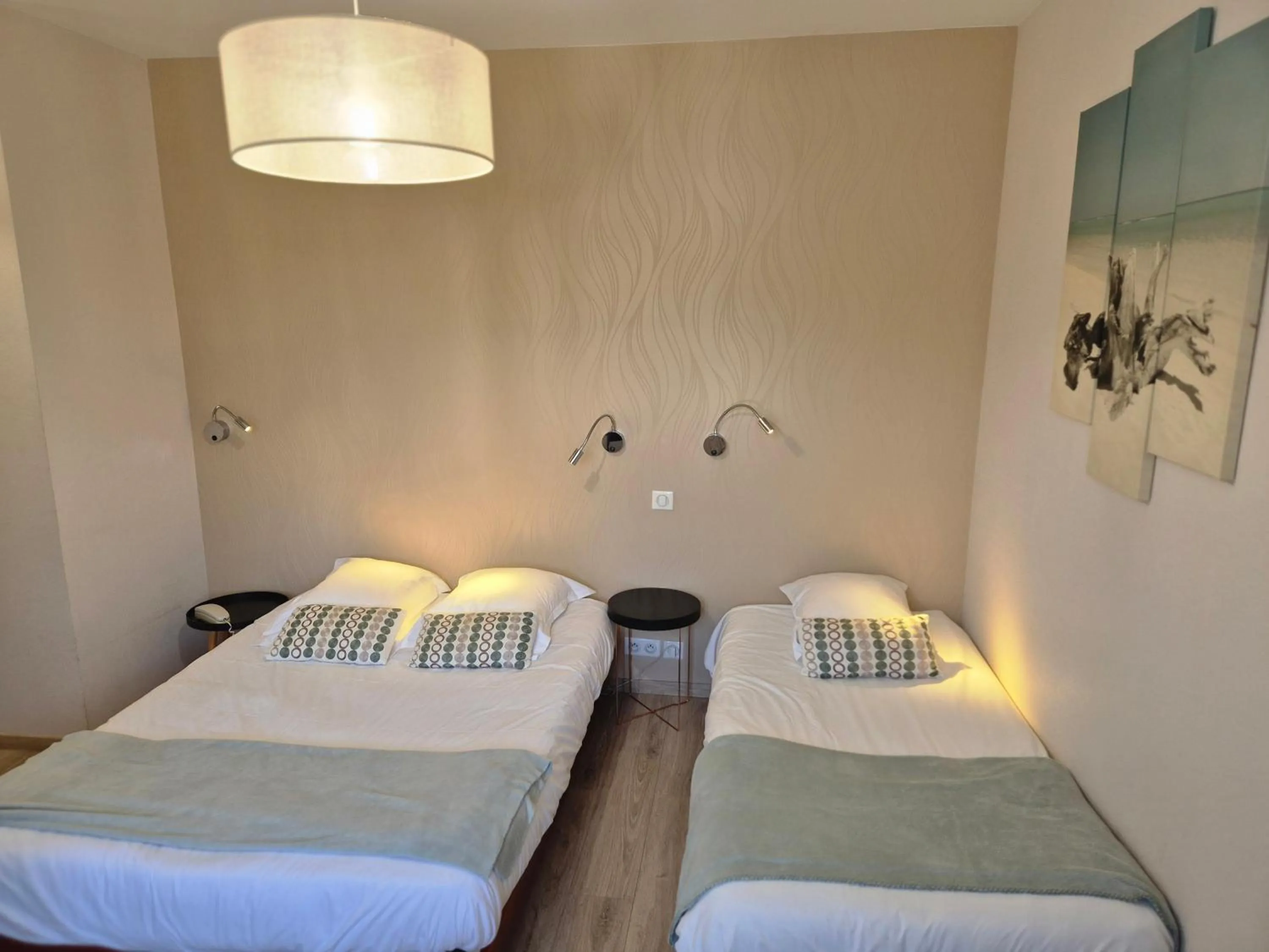 Bed in Logis Hôtel Restaurant L'Oustal