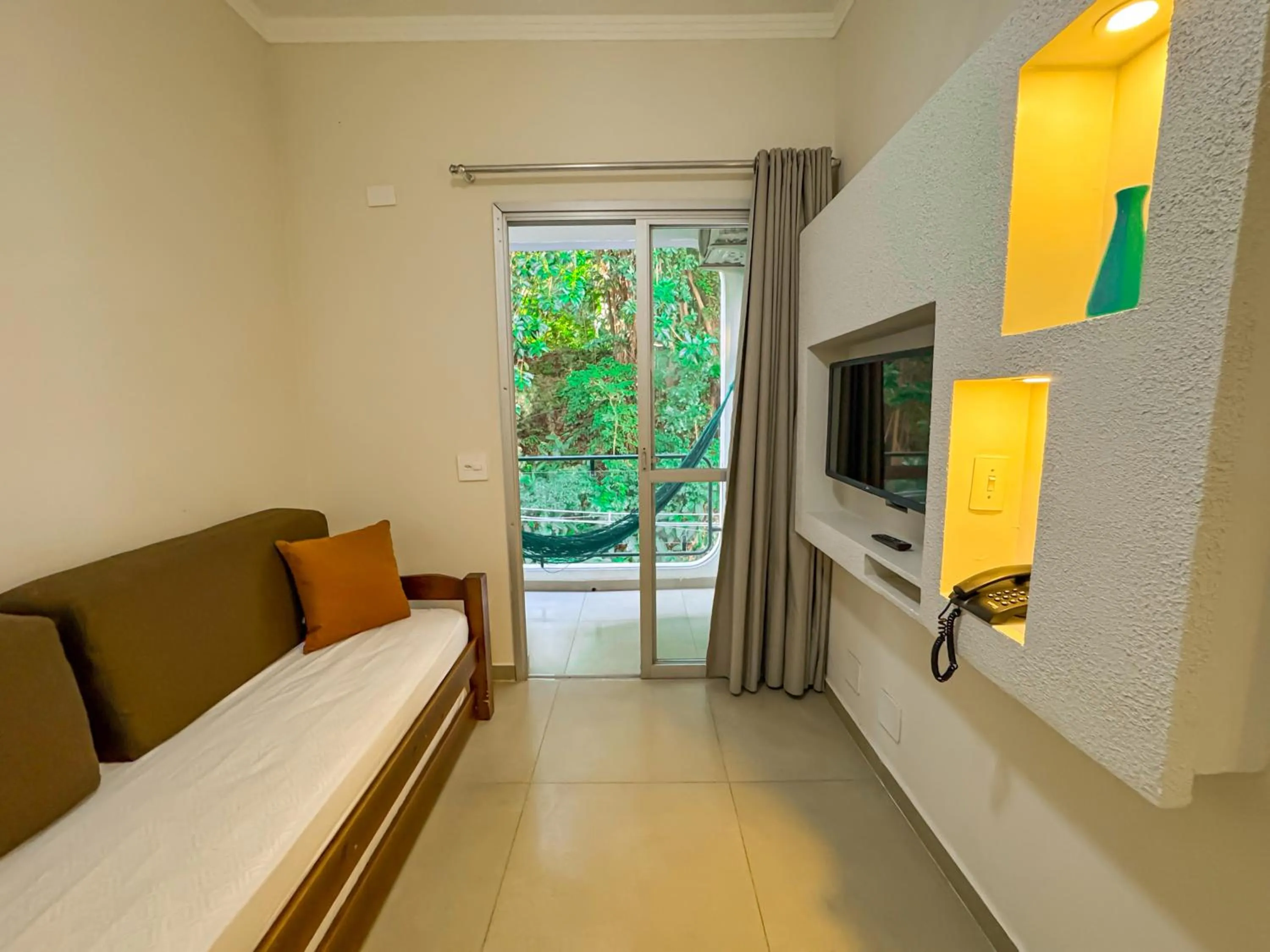 Seating area, Bed in Hotel Nacional Inn Guarujá