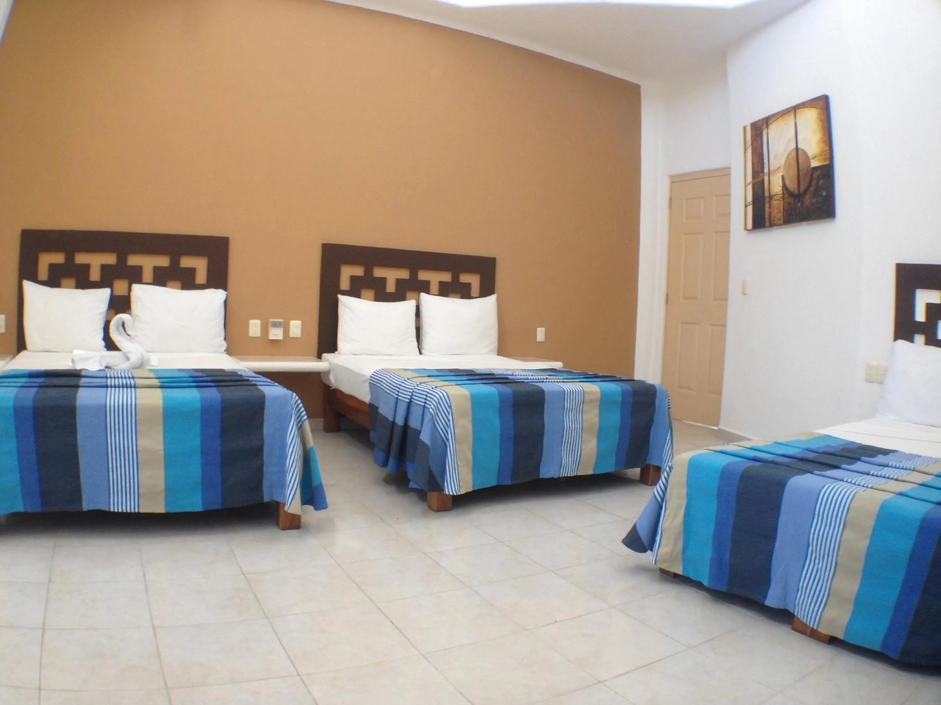 Photo of the whole room, Bed in Hotel Bahia Huatulco