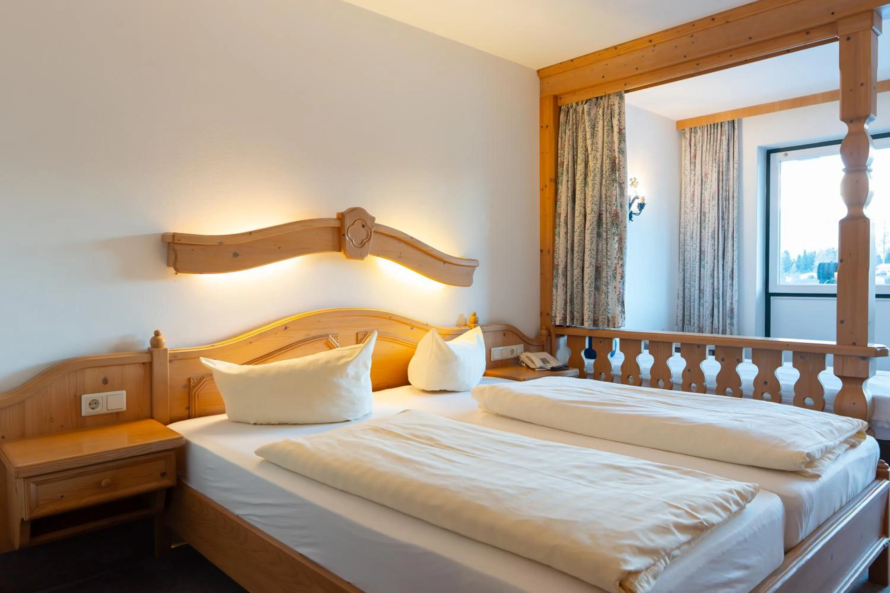 Bed in Hotel Gruberhof Innsbruck Igls B&B