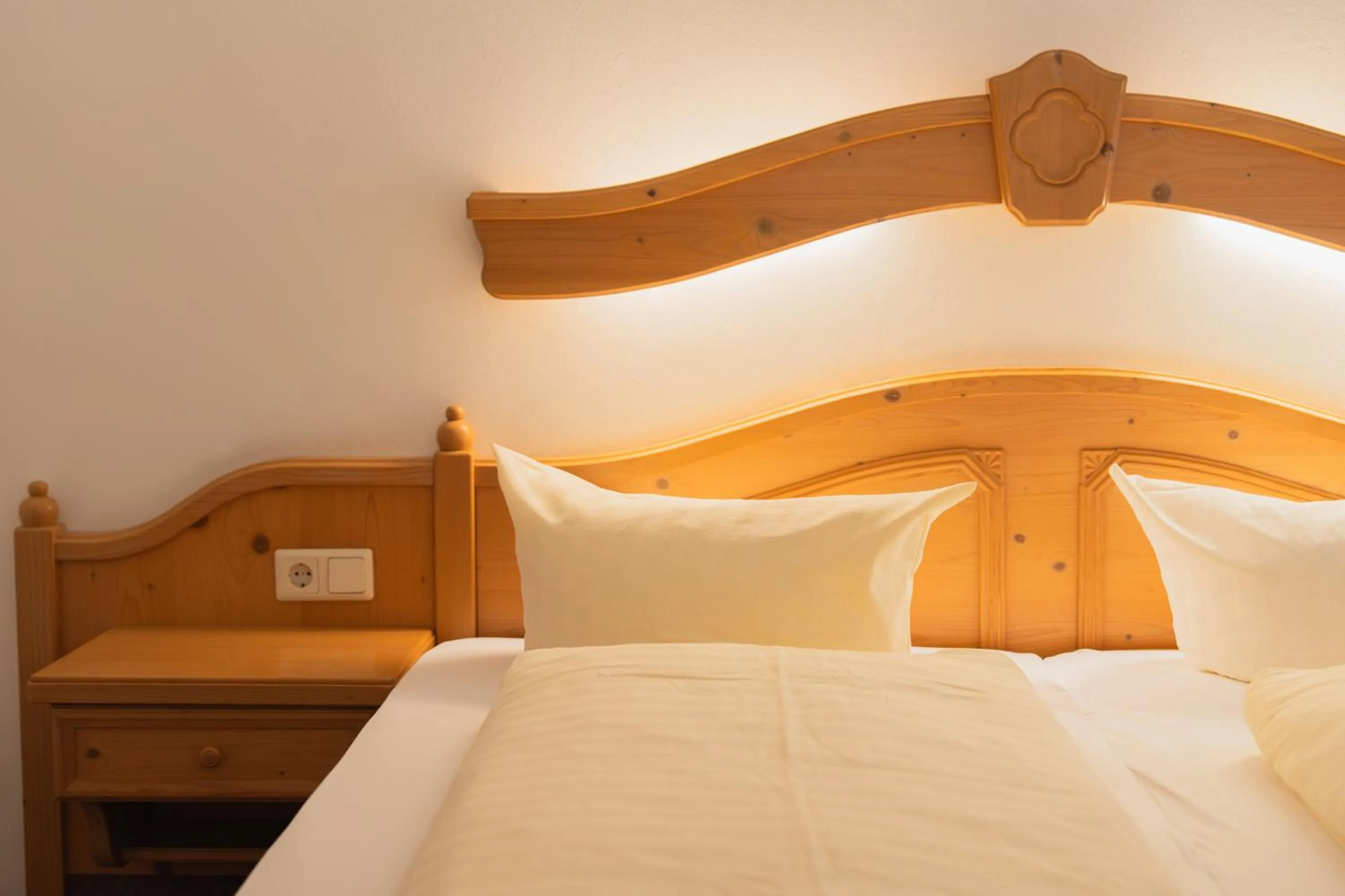 Bed in Hotel Gruberhof Innsbruck Igls B&B