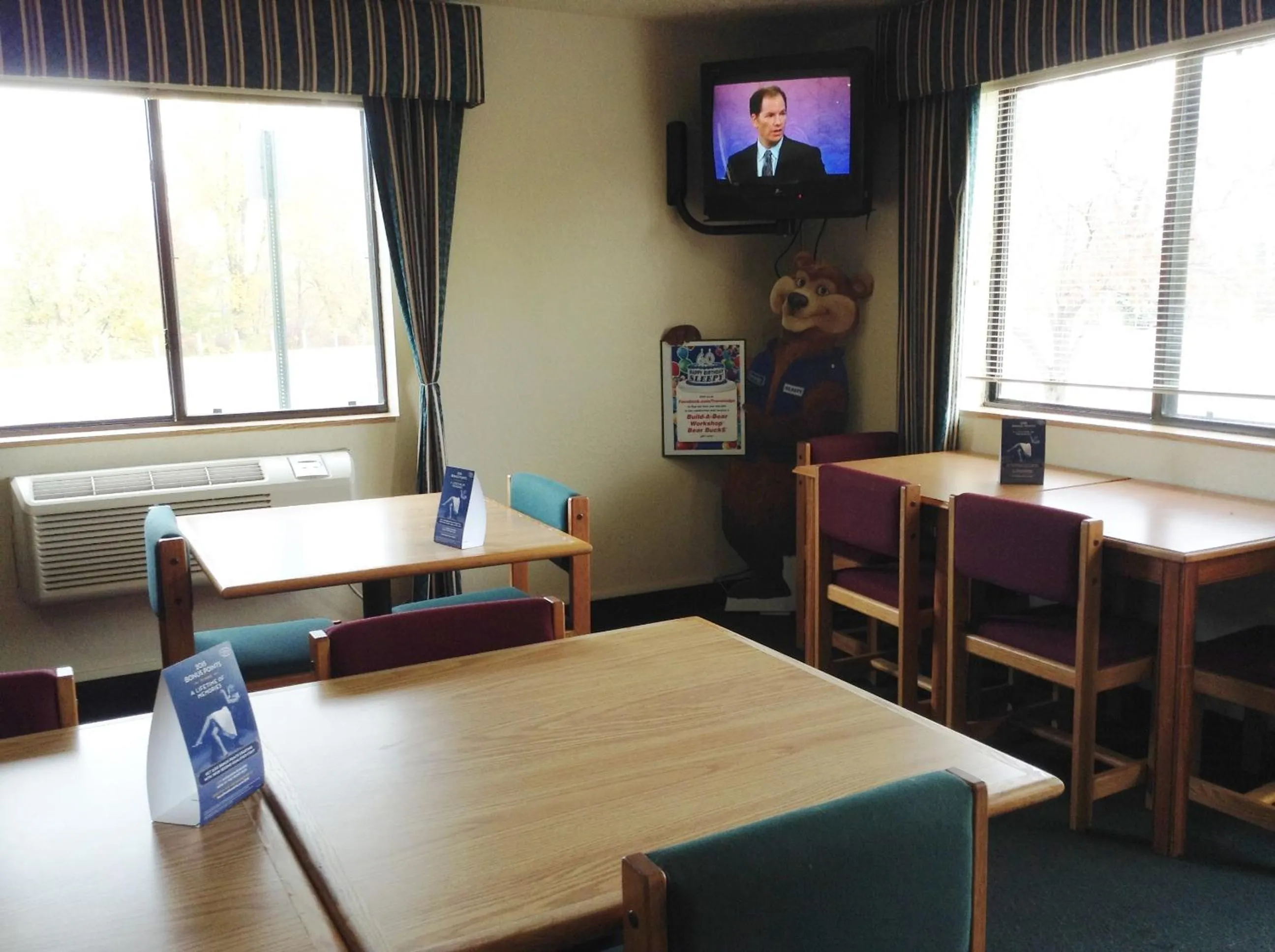 Seating area in Travelodge by Wyndham Hudsonville