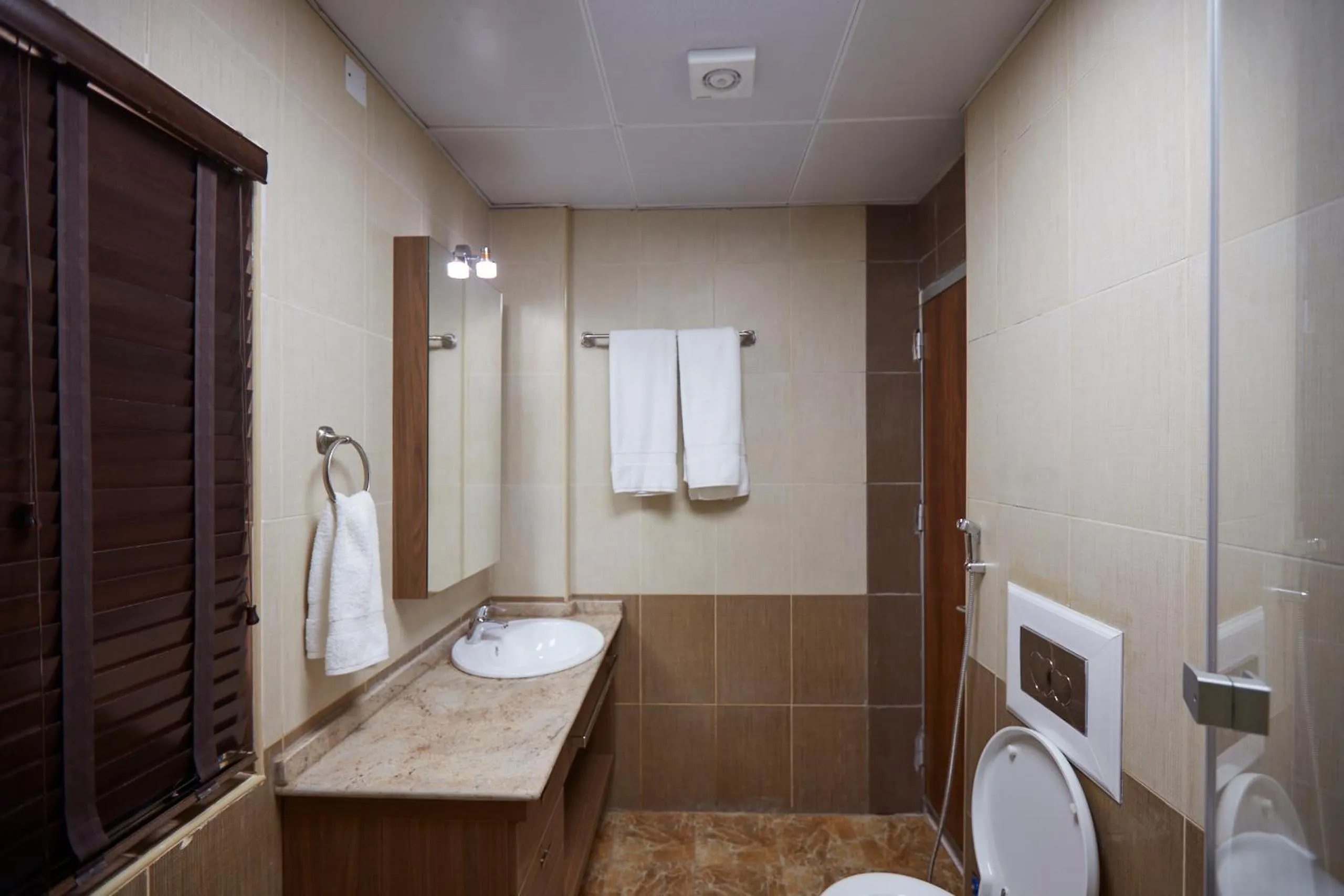 Toilet in Belanova Apartments and Suites