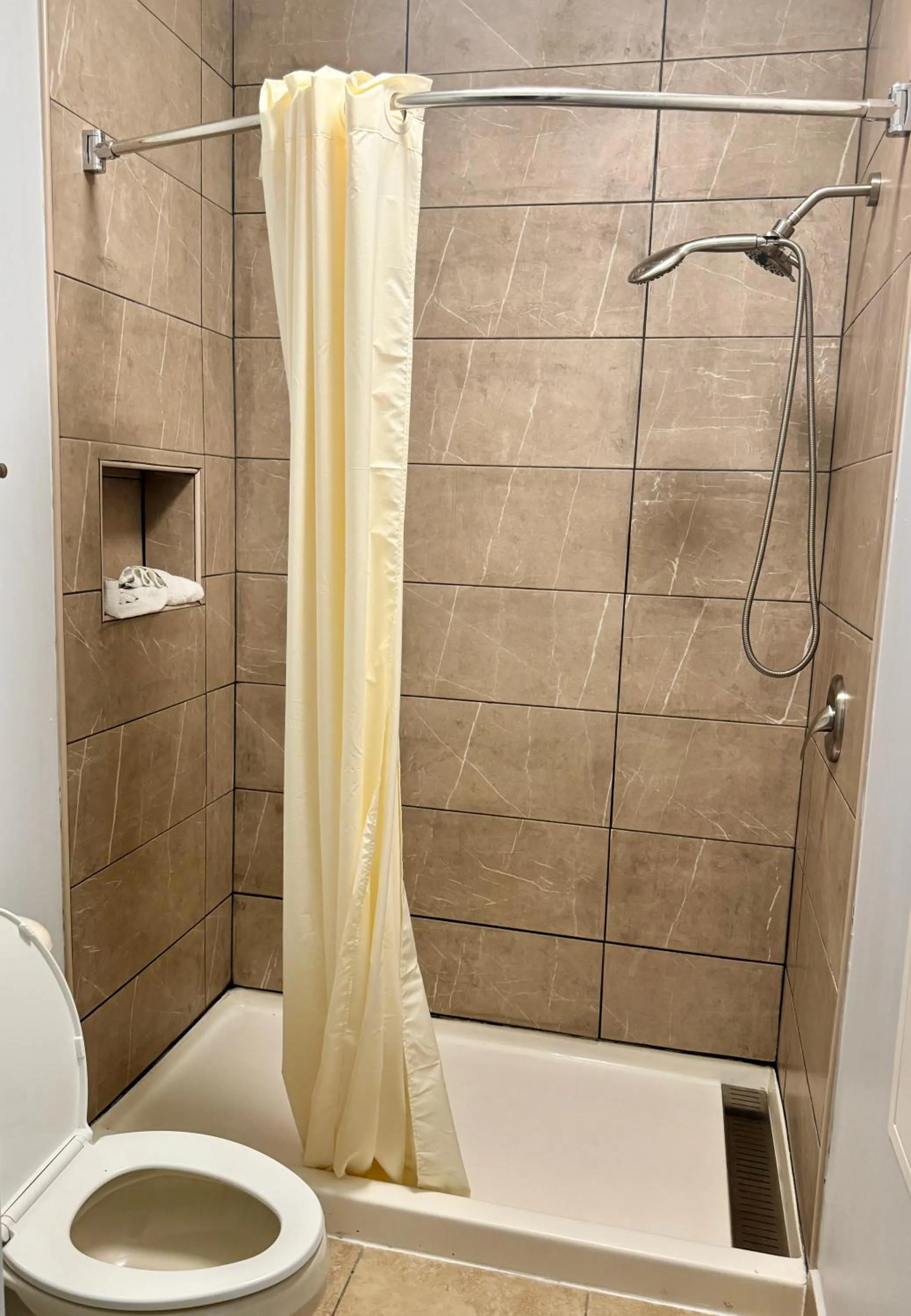 Shower in Texas Inn and Suites City Center at University Dr.