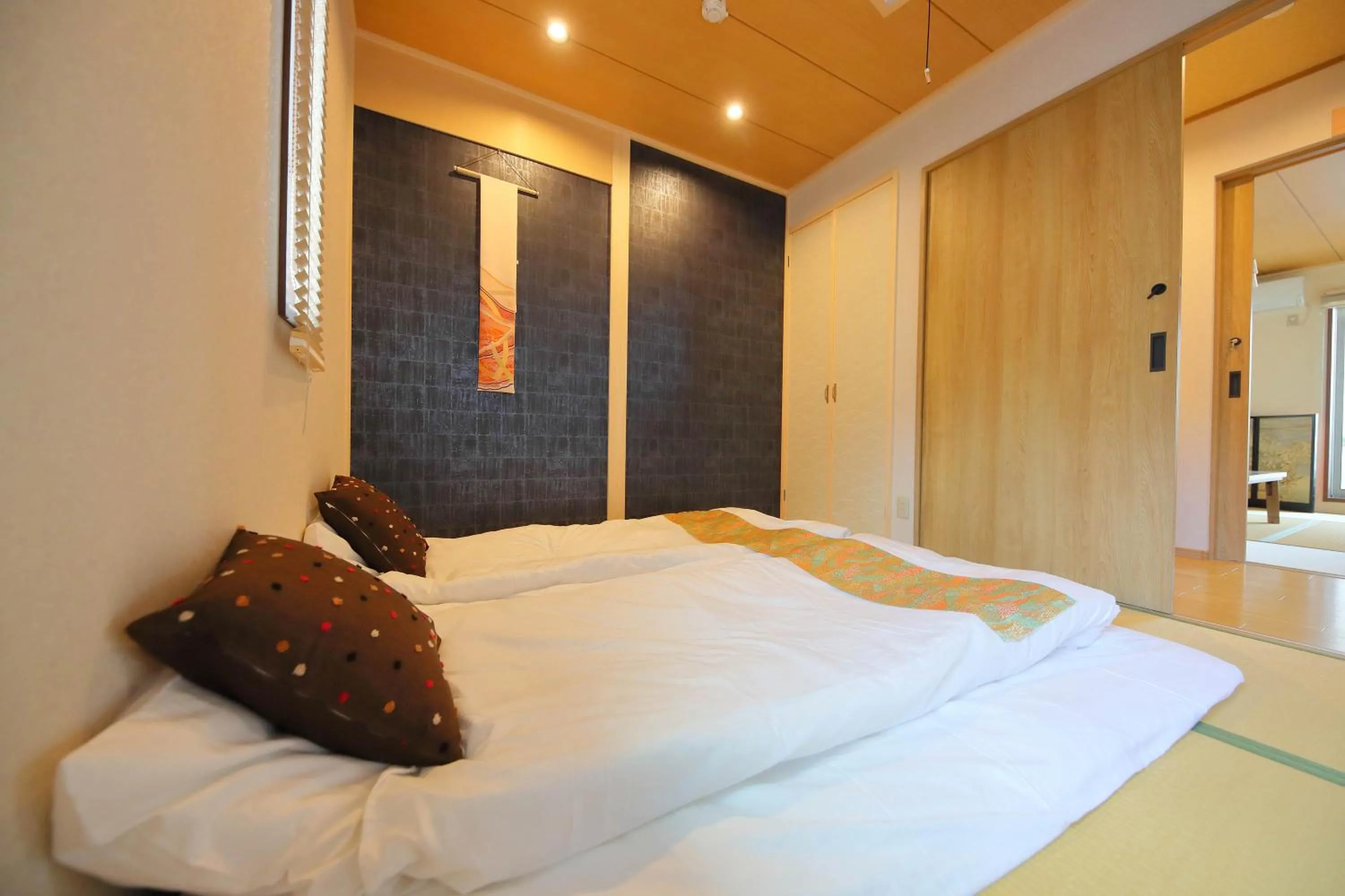 Bed in Kyo Machiya Ryokan Yuan