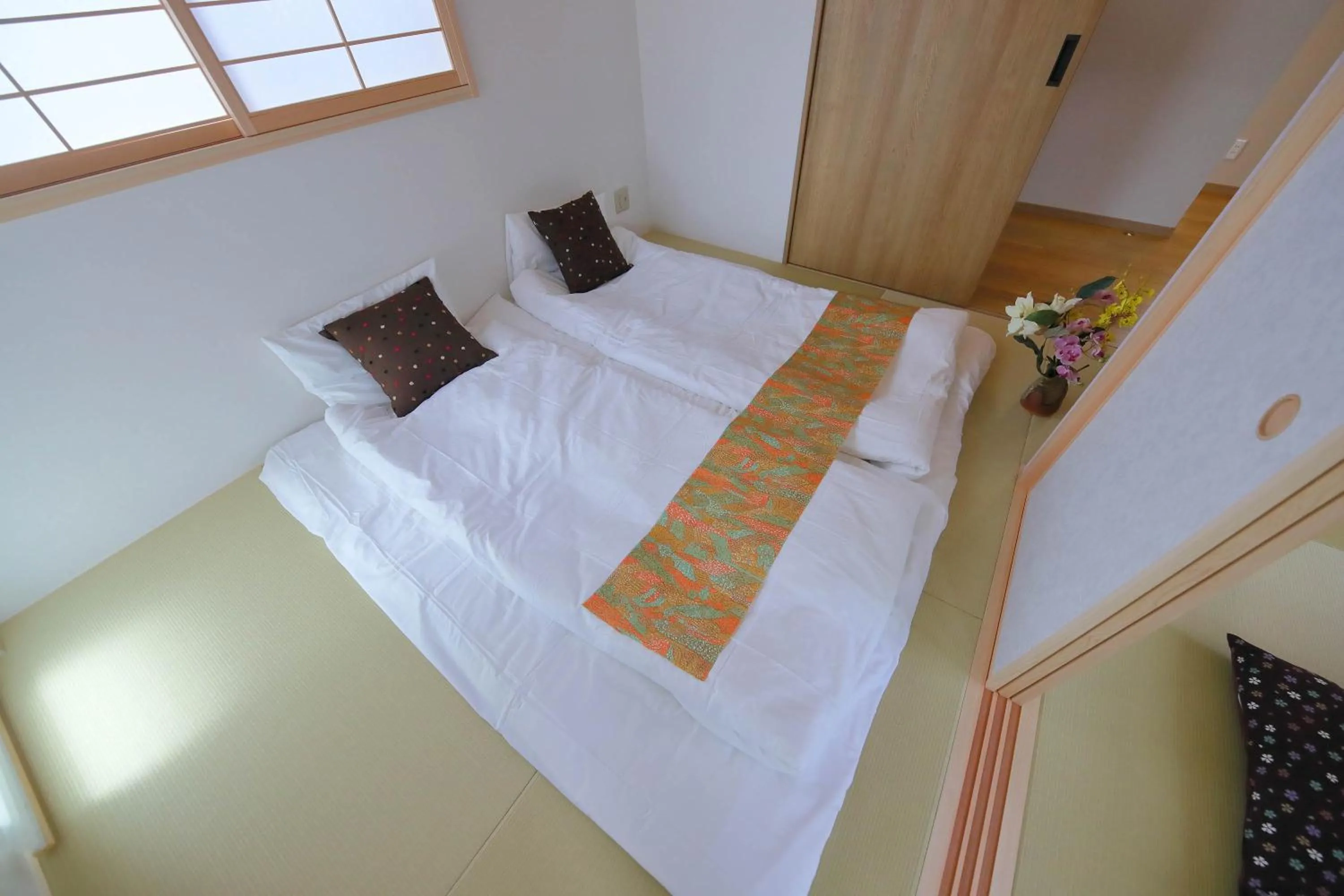 Bed in Kyo Machiya Ryokan Yuan
