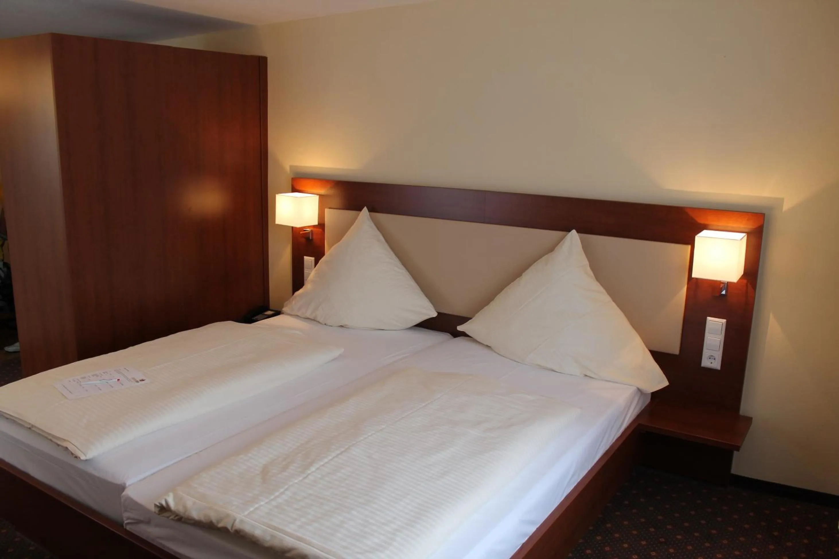 Photo of the whole room, Bed in Stadt-gut-Hotel Gasthof Goldener Adler