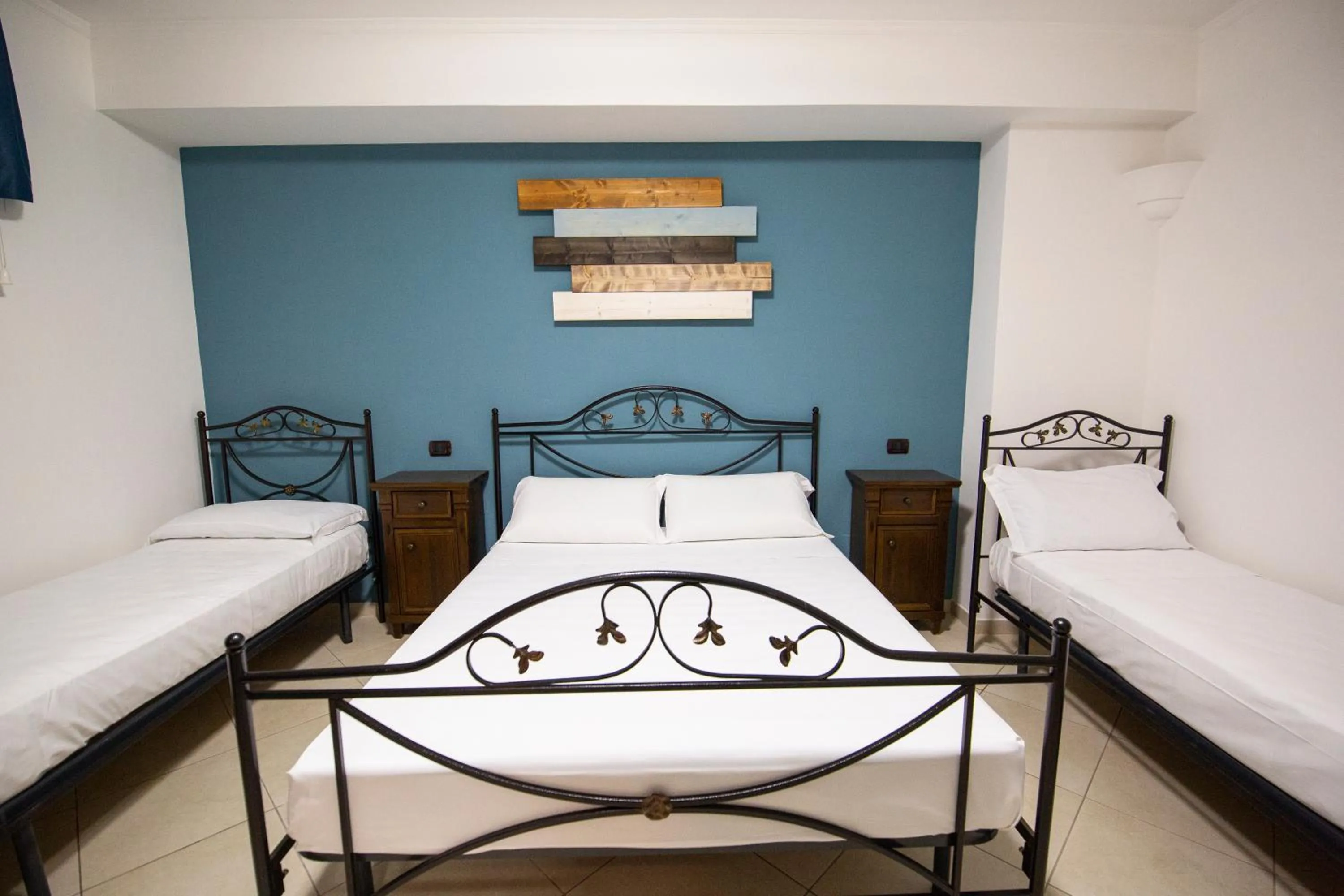 Bed in Pompei Luxury Rooms