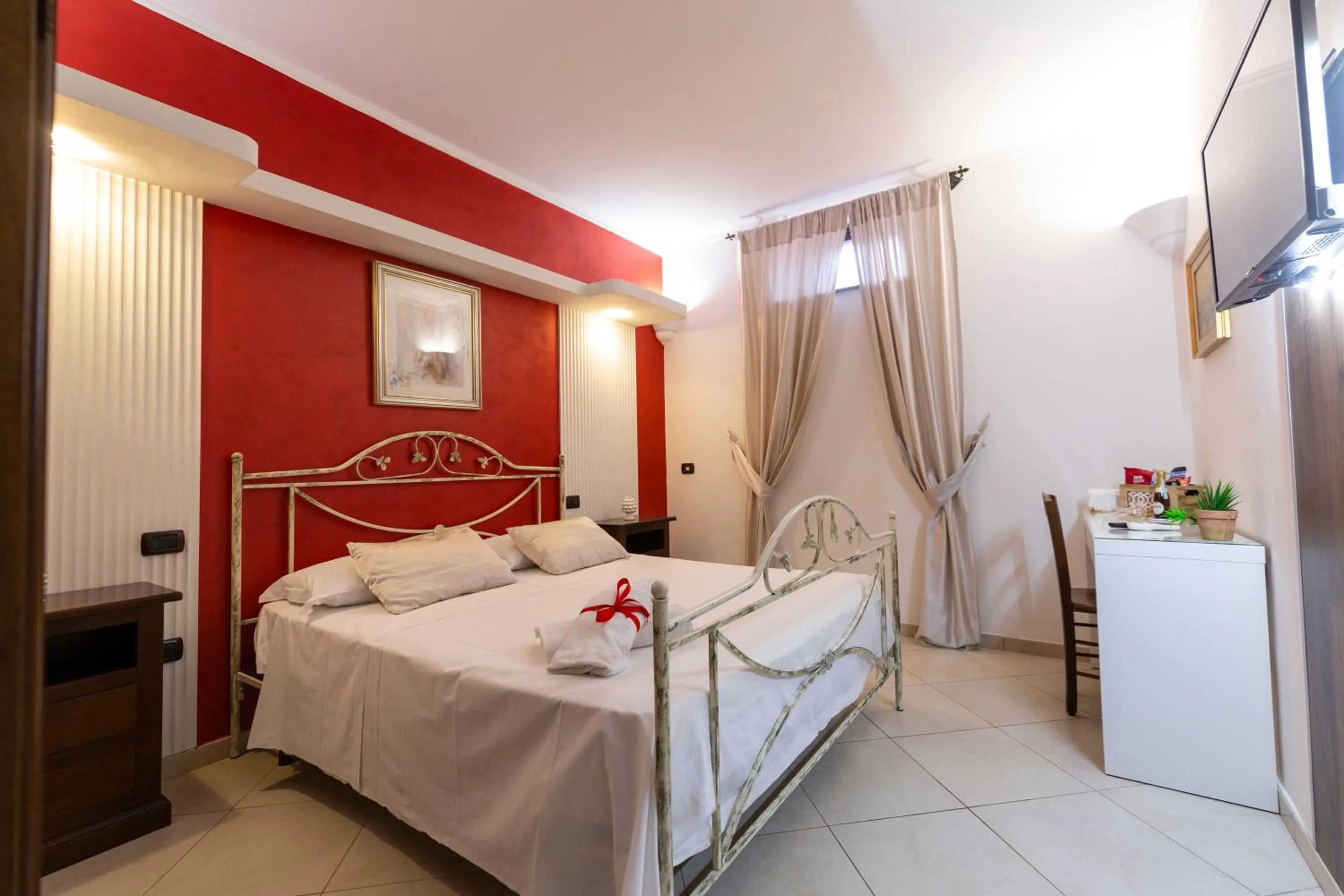 Bed in Pompei Luxury Rooms