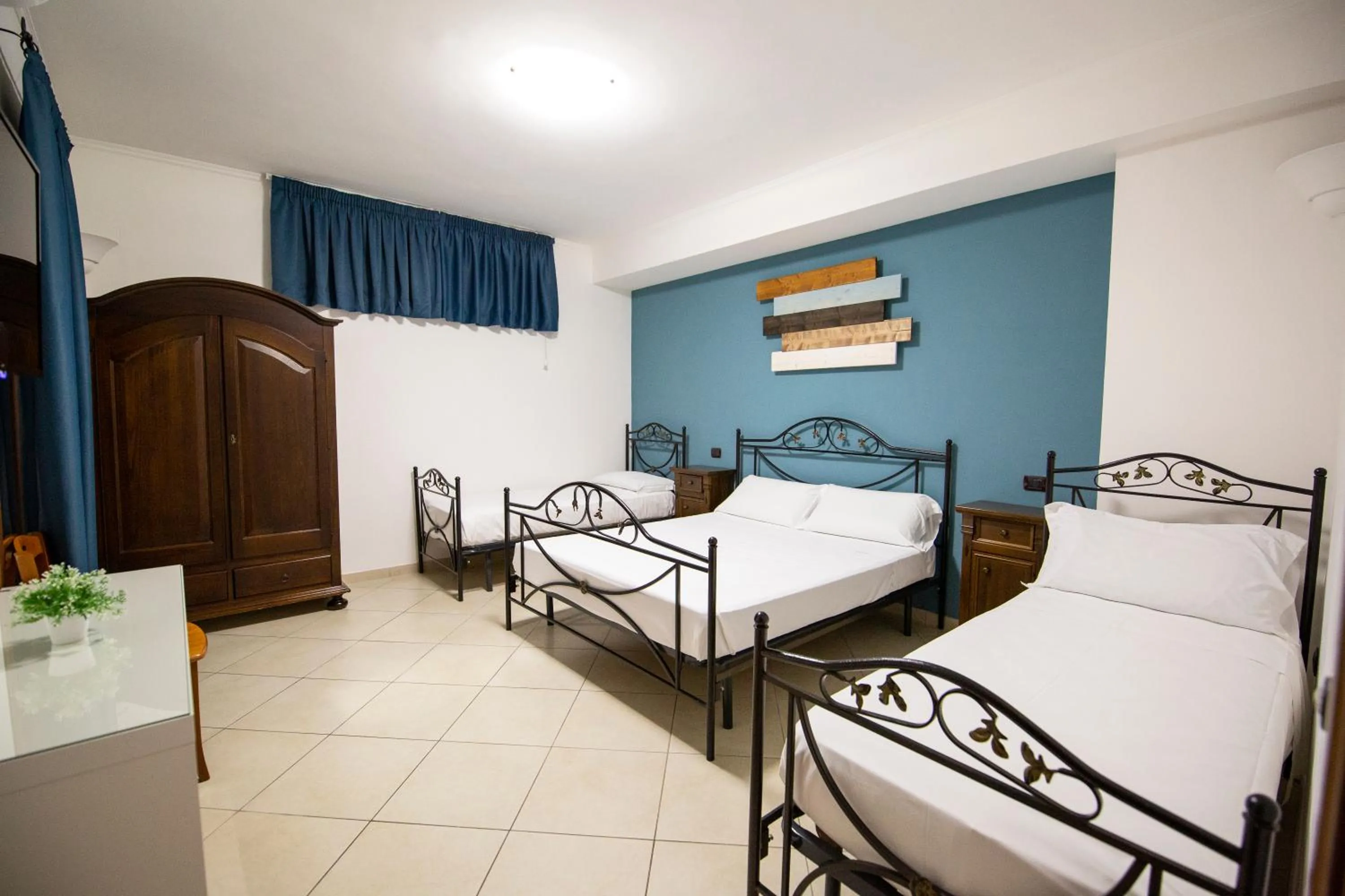 Bed in Pompei Luxury Rooms