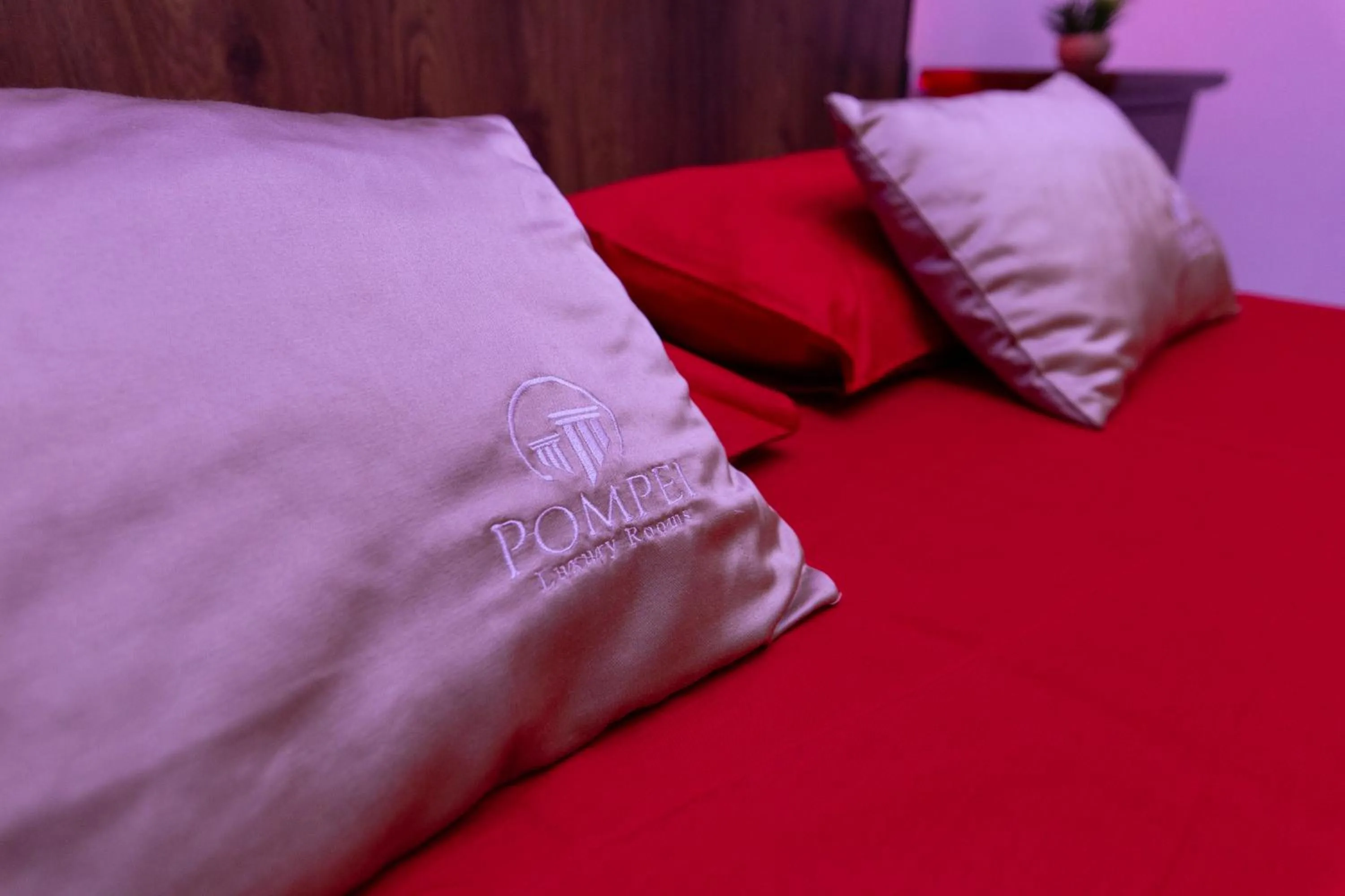 Bed in Pompei Luxury Rooms