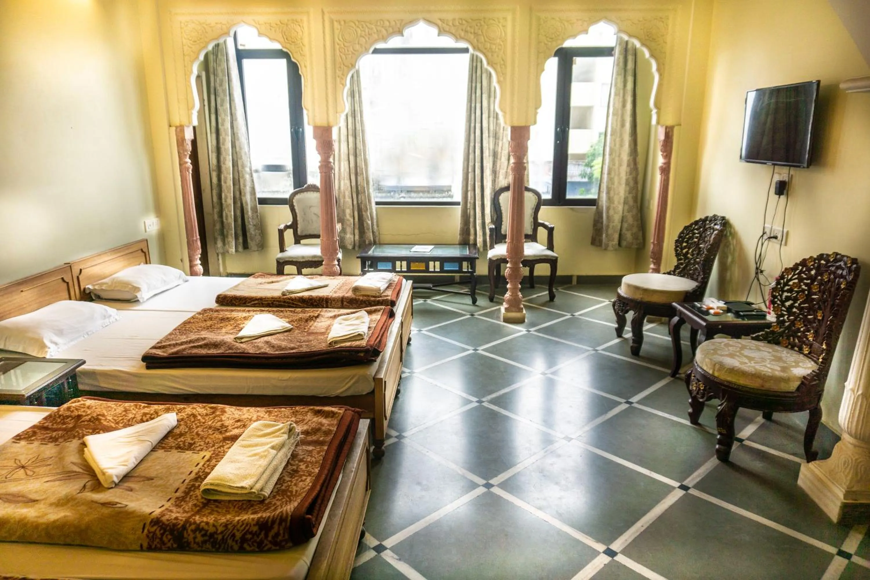Living room, Bed in Krishna Palace - A Heritage Boutique Hotel