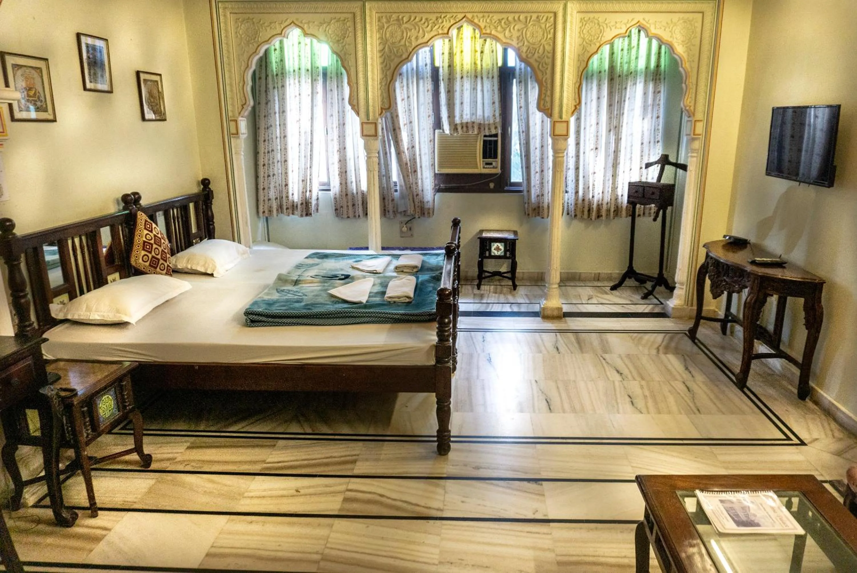 Bed in Krishna Palace - A Heritage Boutique Hotel