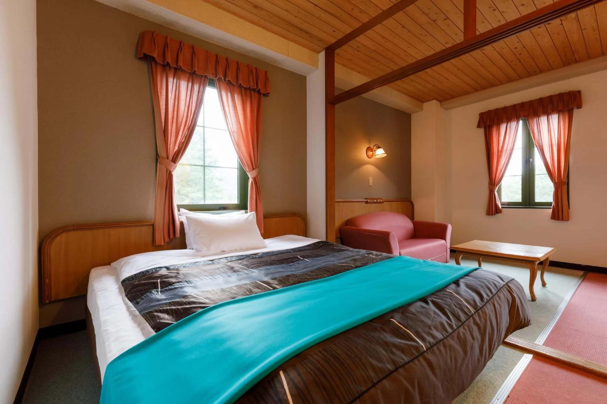 Bed in ホテルけやきの樹