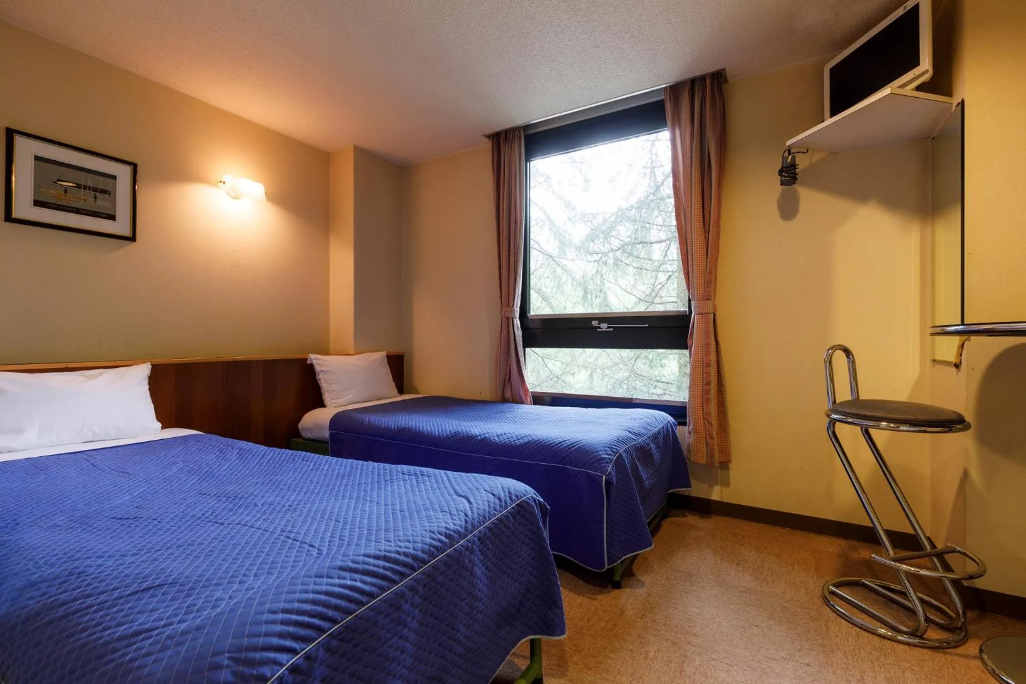 Bed in ホテルにれの樹