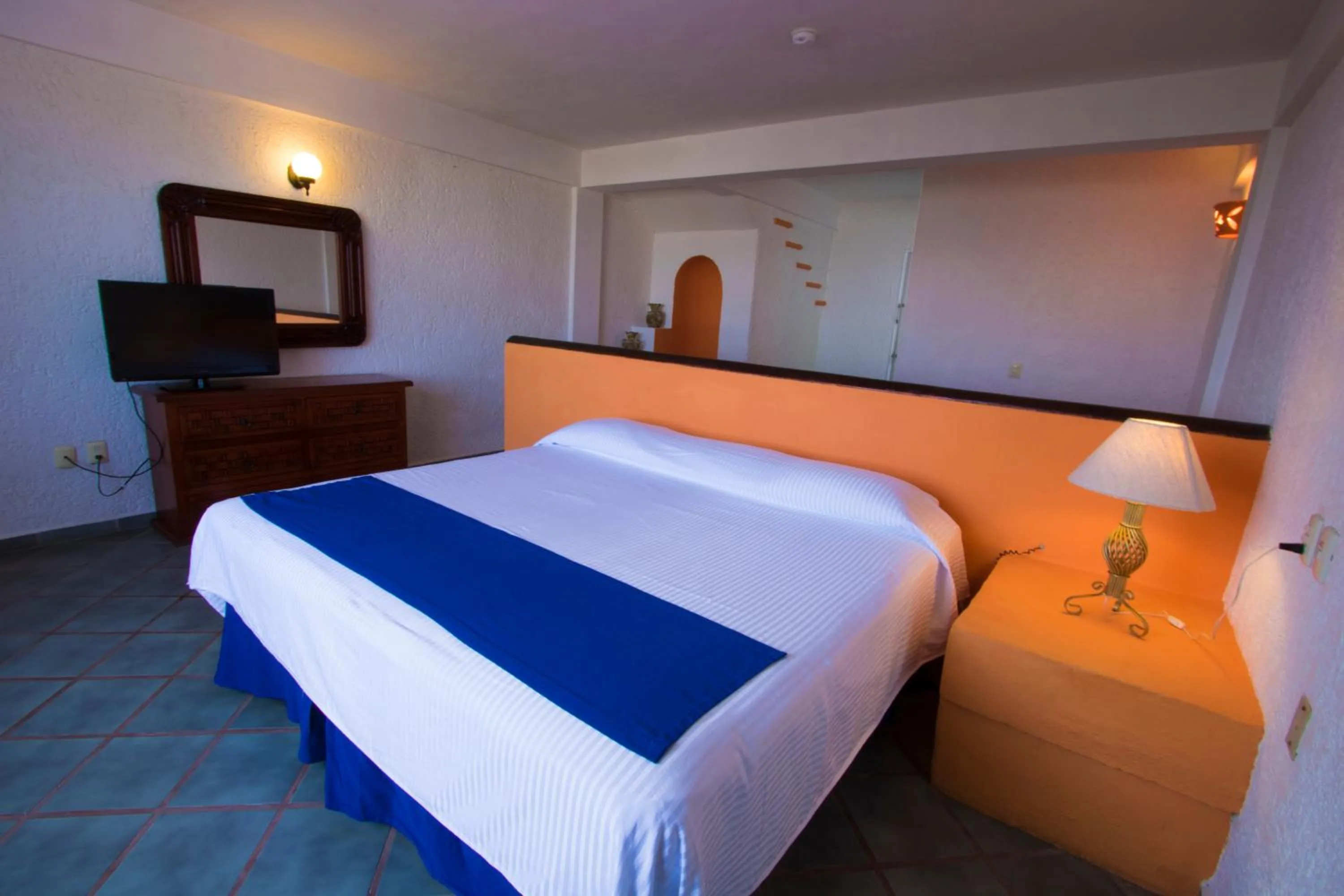 Communal lounge/ TV room, Bed in Decameron Los Cocos Guayabitos, Ramada All-Inclusive Resort